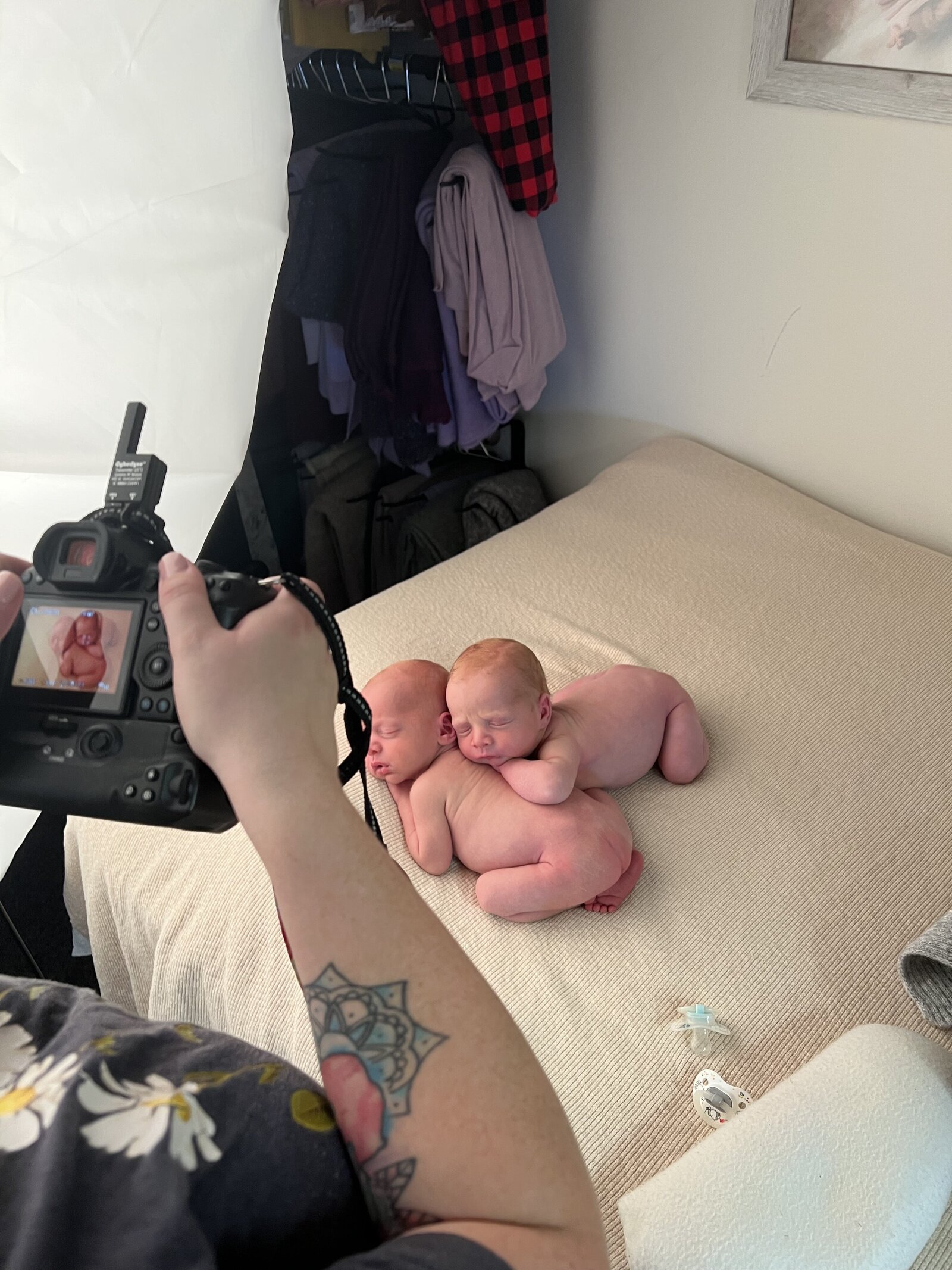 newborn photographer taking picture of twins in cedarburg