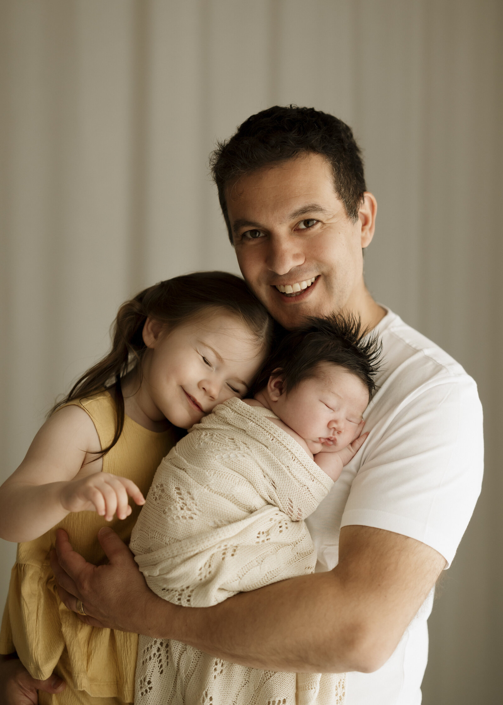 natural newborn family portraits in a Perth studio – soft, warm, and organic images capturing the love of a growing family.