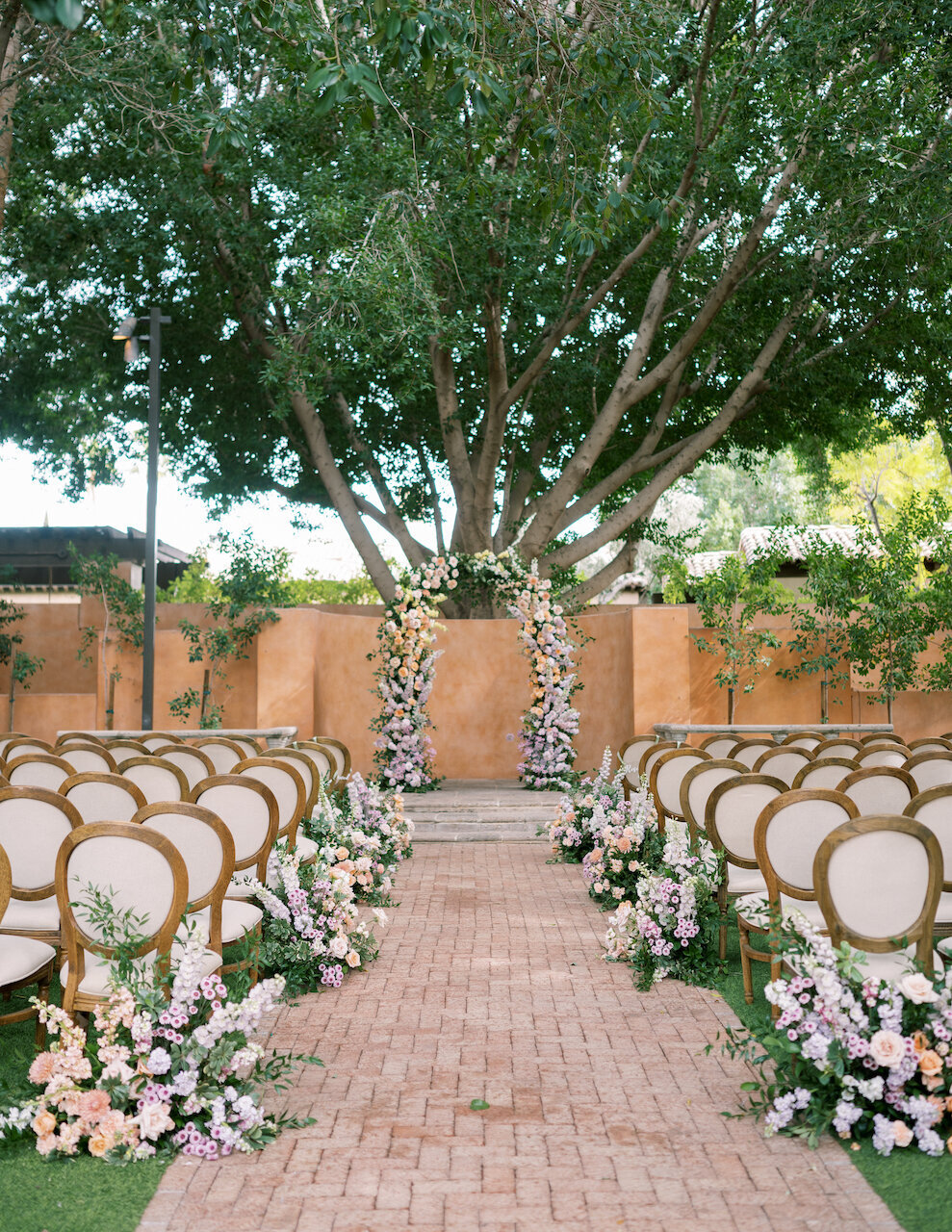 royal-palms-ceremony-design-ground-flowers-arch-organic-wedding-flowers