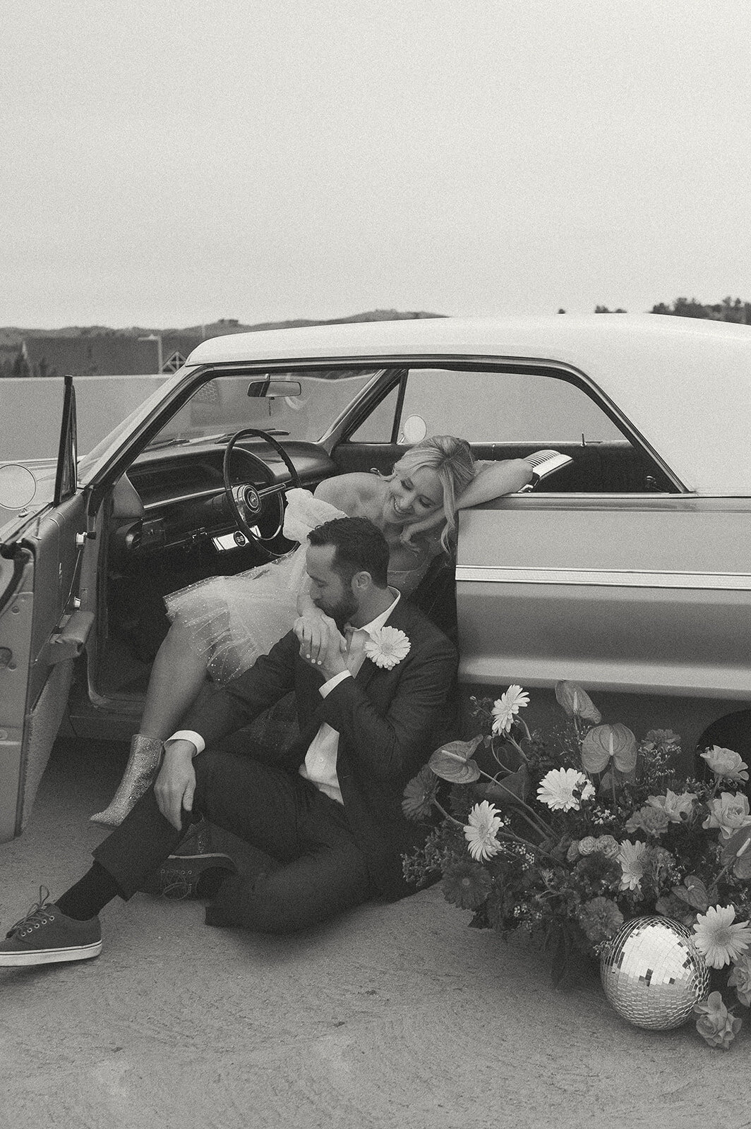 elopement photo with vintage car and bride and groom