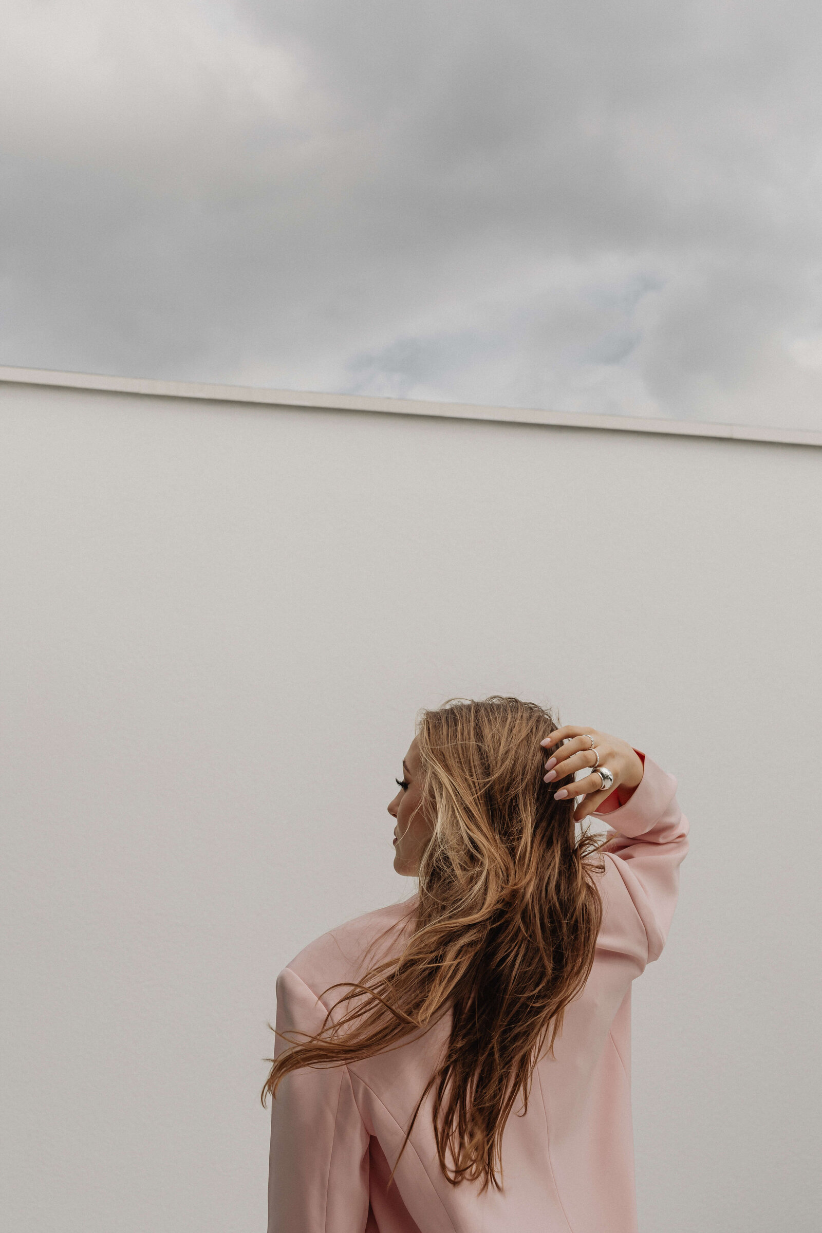 pink suit from behind woman