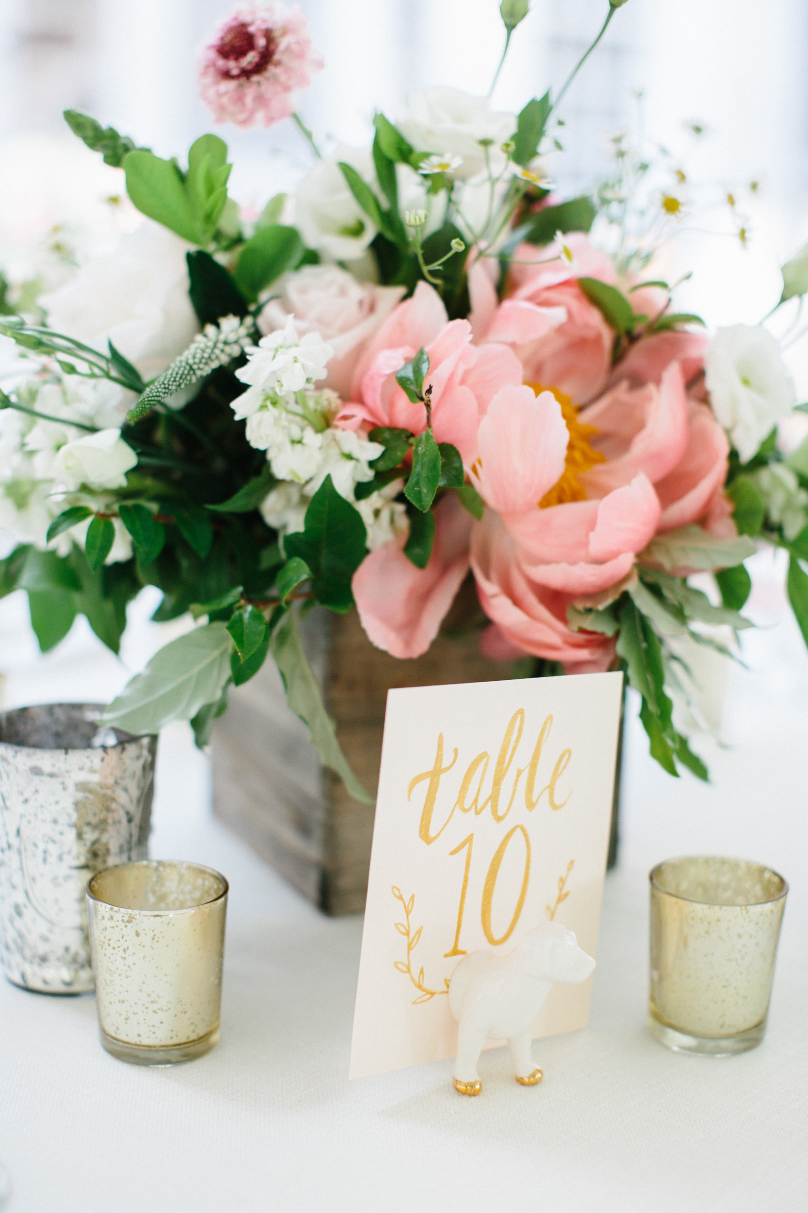 Gorgeous foral wedding table arrangements  at this summer wedding.