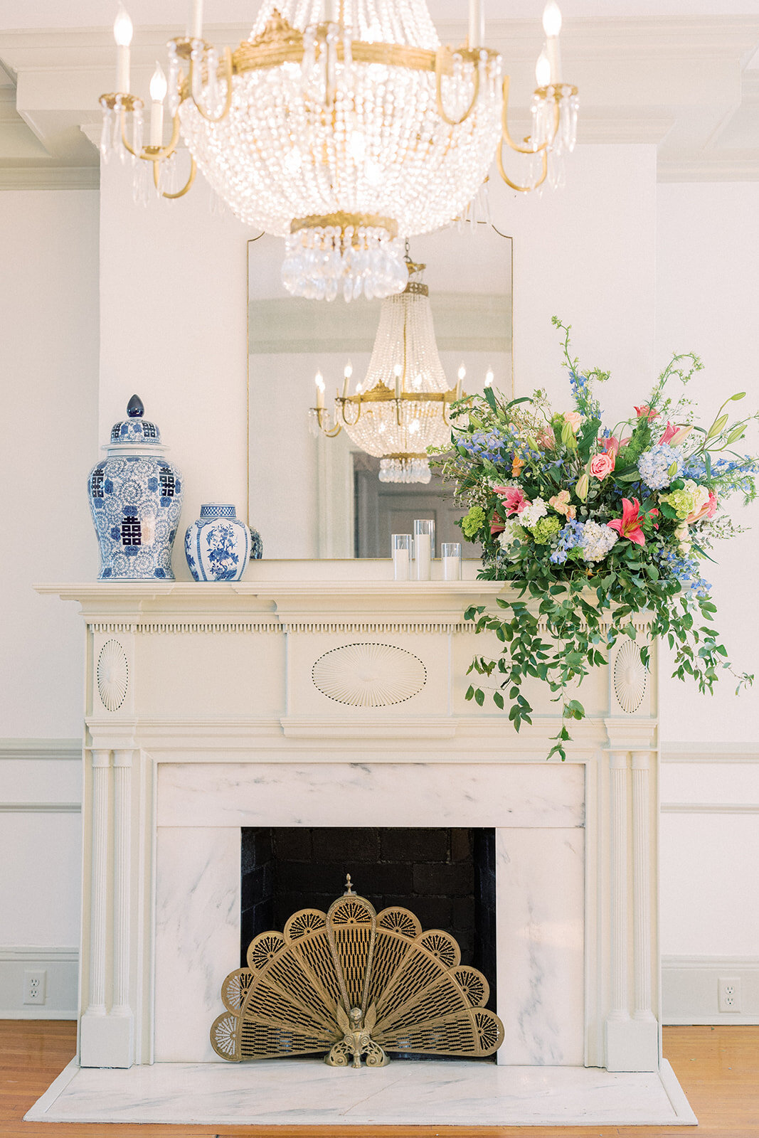 fireplace with ginger jar and floral arrangement at 255 milledge