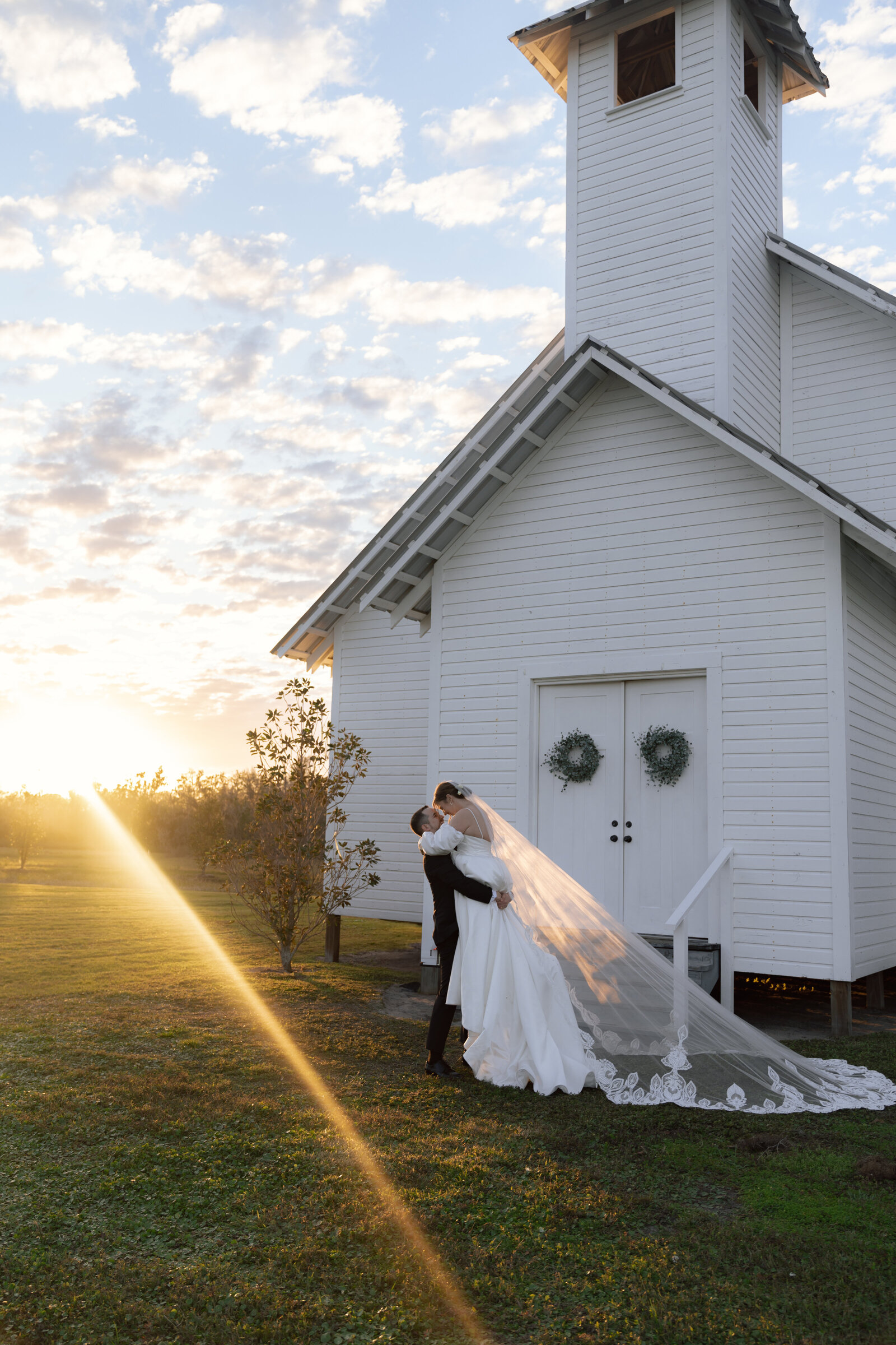 bride and groom in front of a church wedding photos