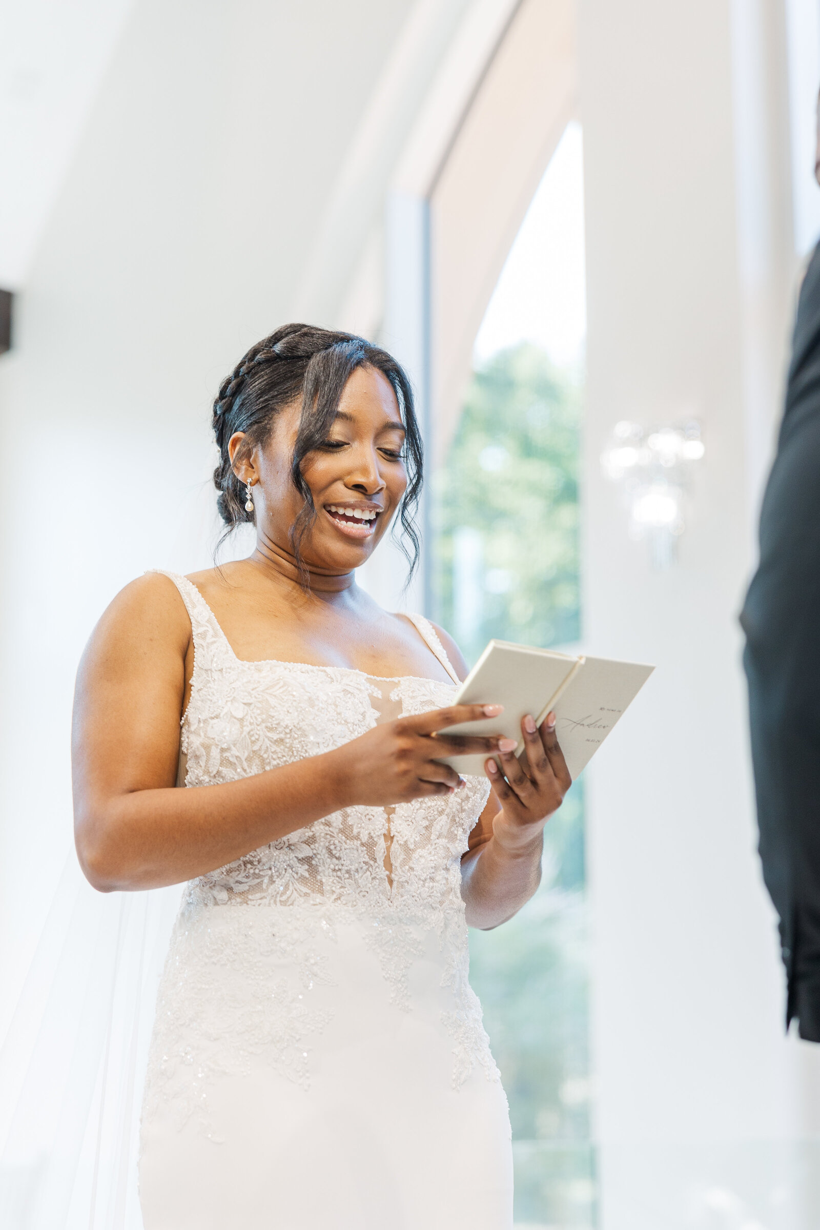 Bride reading vows to the groom at wedding ceremony