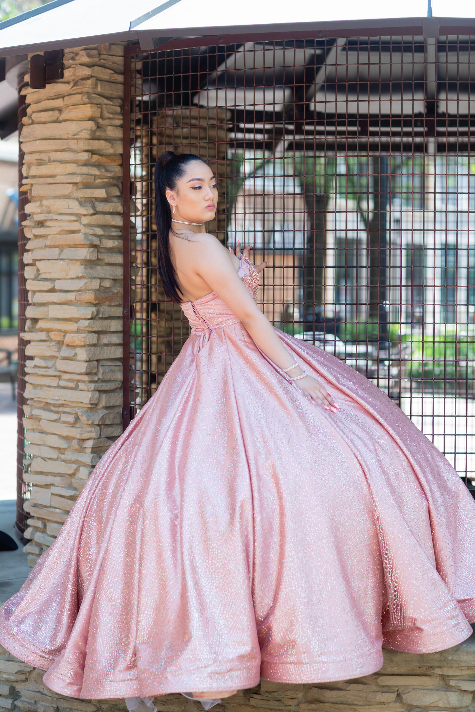 Rosalyn posing elegantly at the historic Playhouse Square in Cleveland, Ohio, blending her quinceañera grace with the charm of the Theater District.