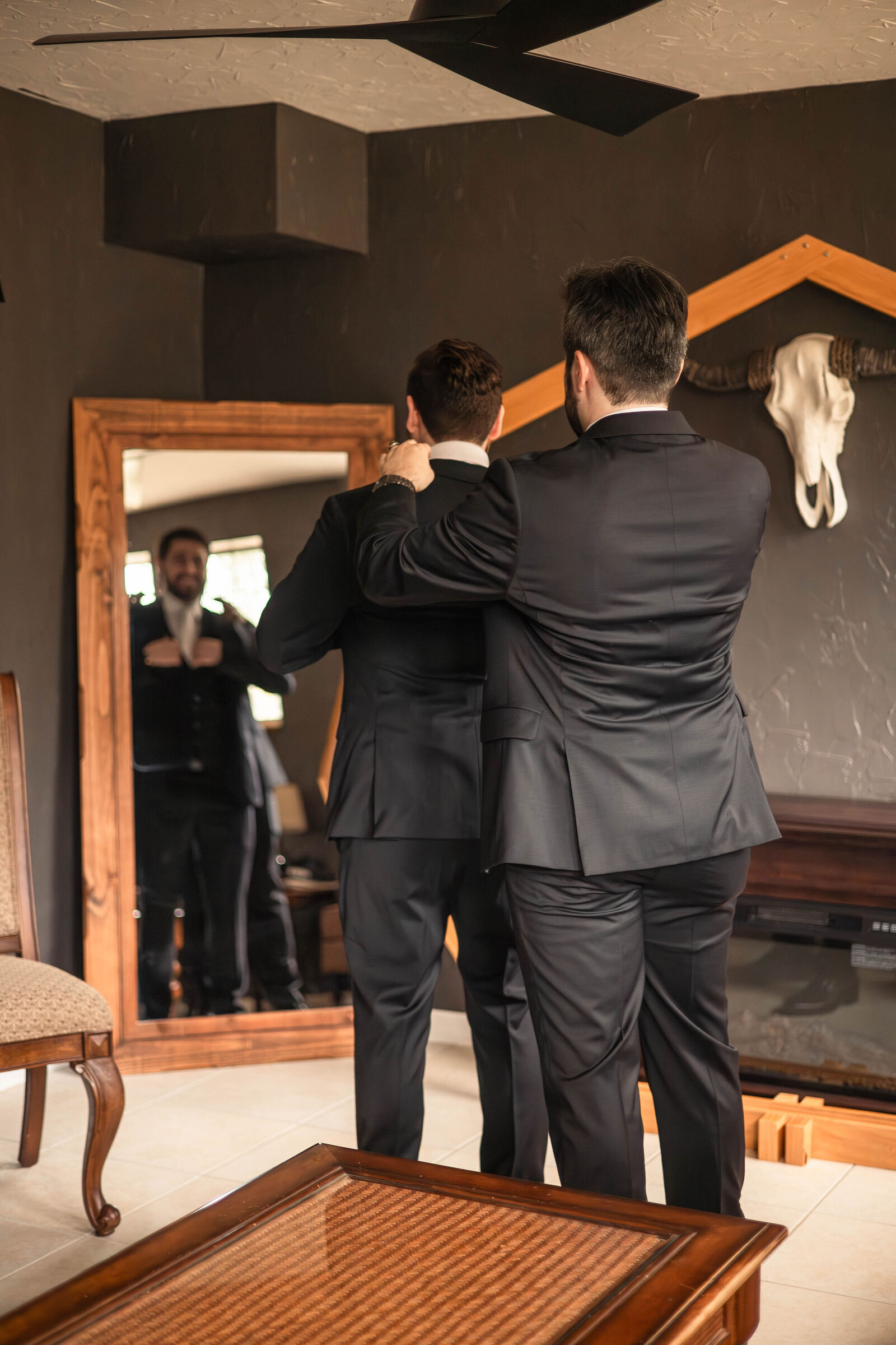 groom getting ready with groomsman