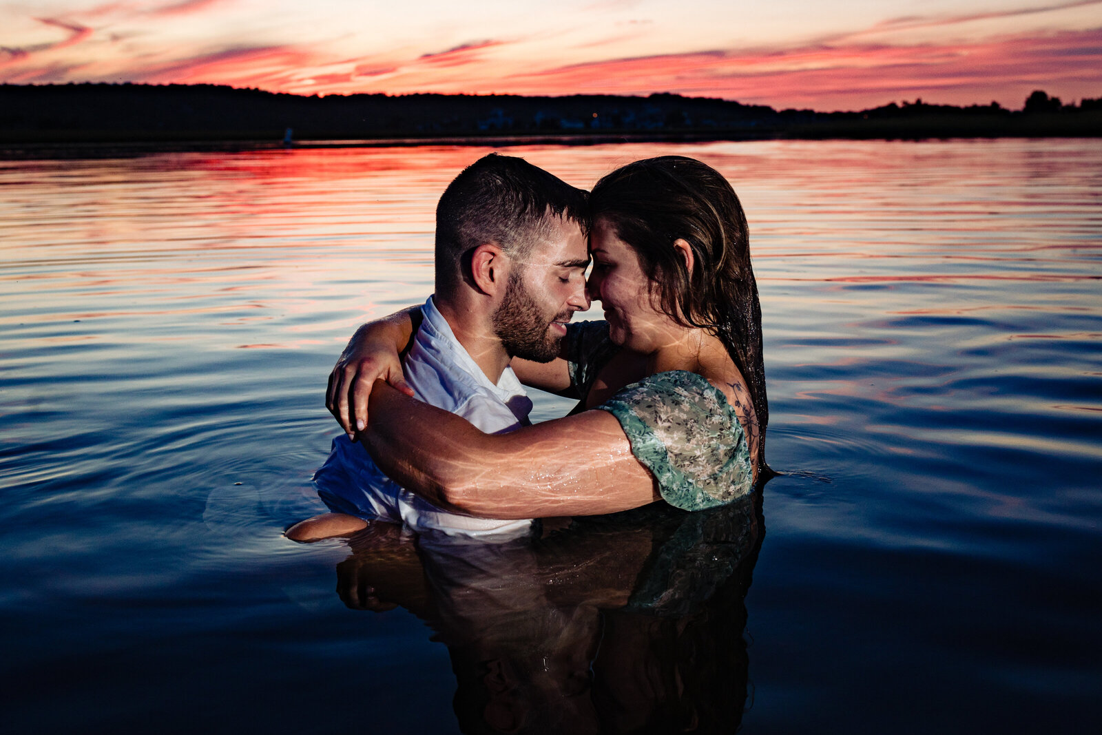 dramatic-engagement-couple-in-water-at-sunset-lisa-gilbert-photography