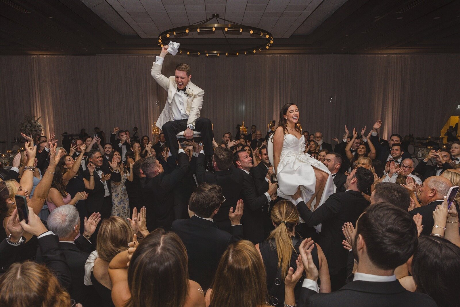 couple-lifted-on-chairs-florida-reception