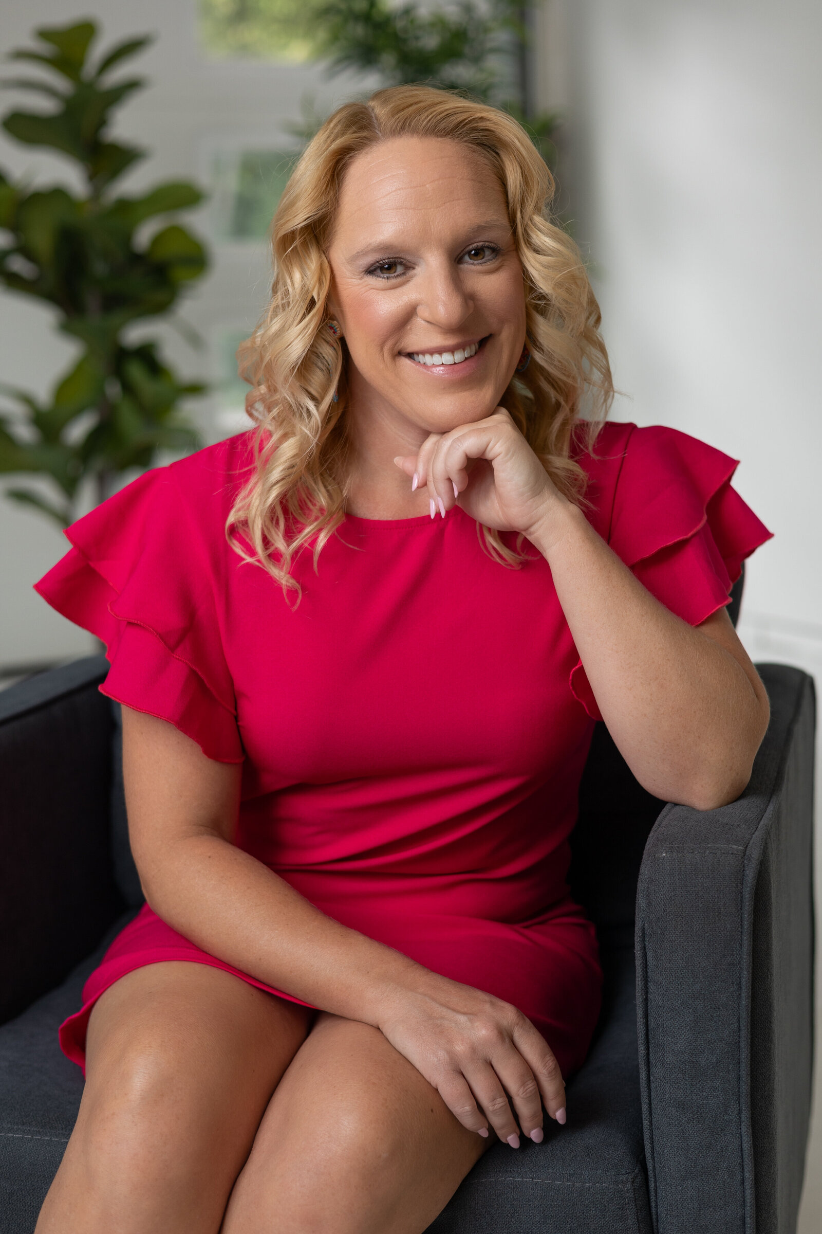 Corporate photo of woman in red dress