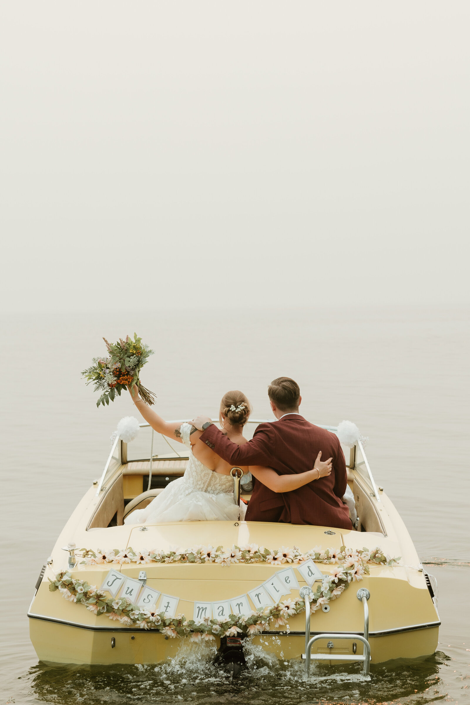 married couple on a boat in sandpoint idaho
