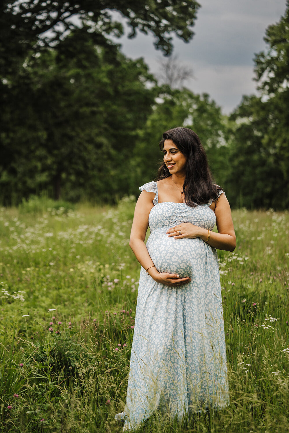 pregnant mom in light blue dress takes summer maternity photos in boston