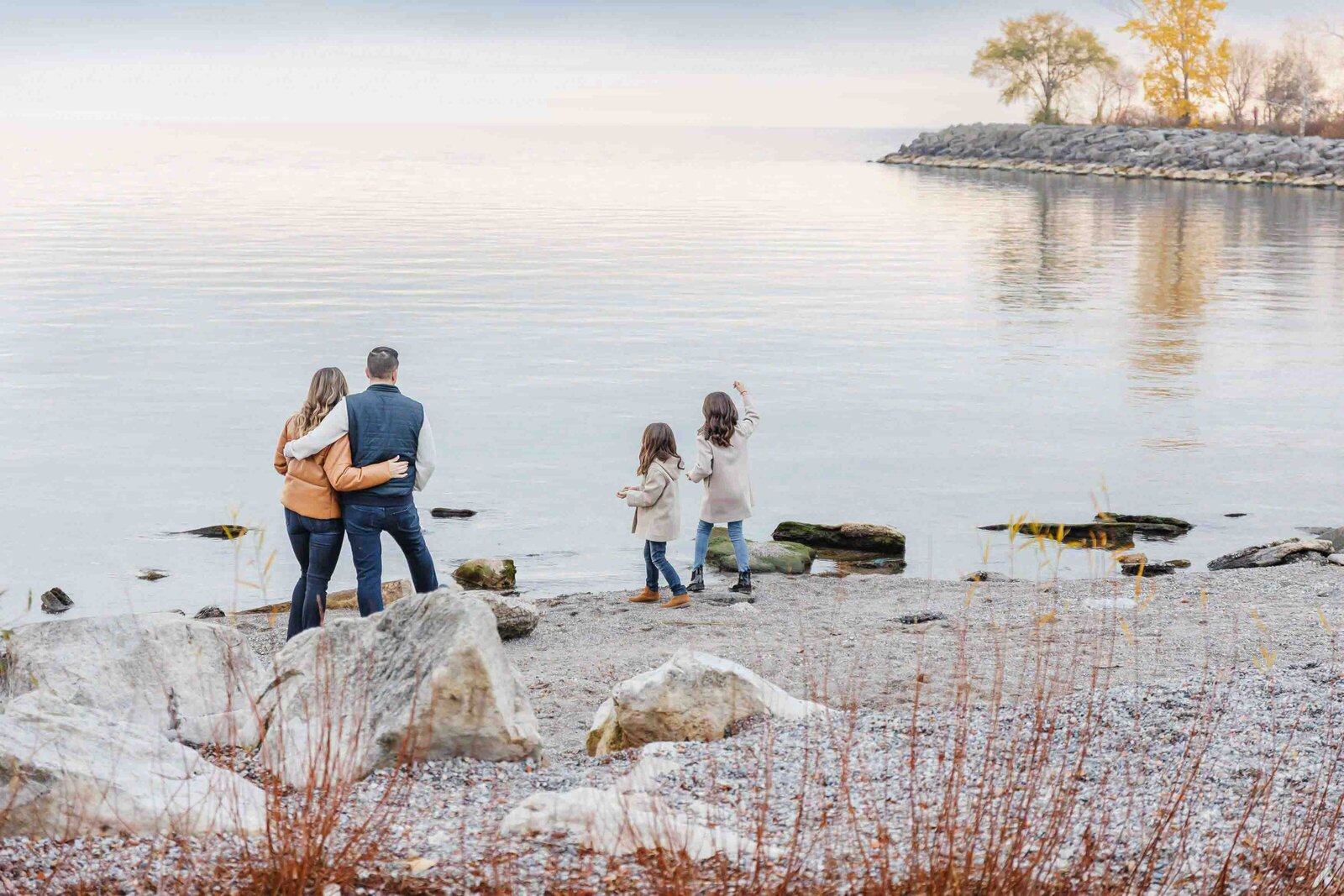 Toronto family portrait session, highlighting joyful moments with parents and children in a relaxed atmosphere