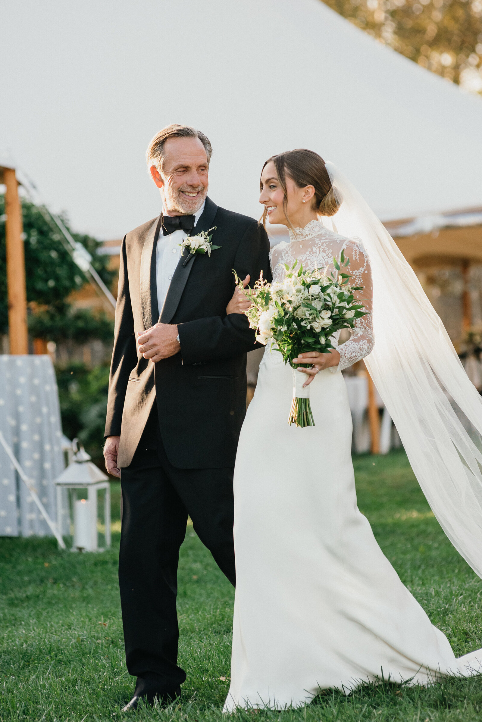 Bride walking down the aisle of her outdoor Radnor Hunt Landing wedding near Philly. 