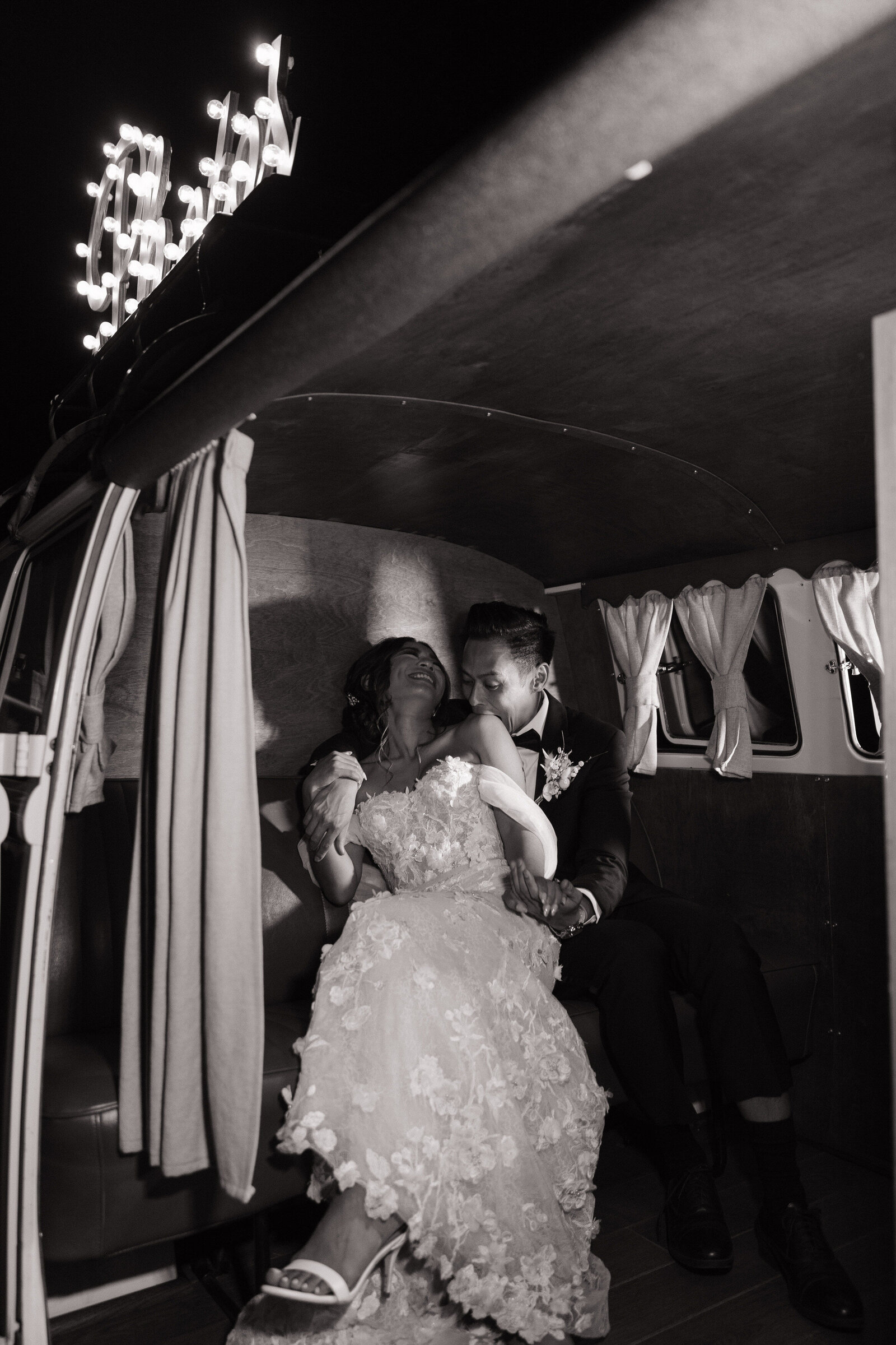 Couple embrace in photo booth by Washington elopement photographer, Erica Rochelle