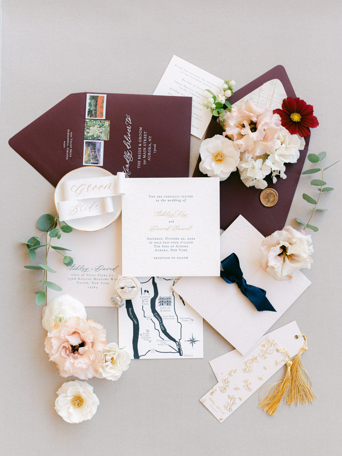 Luxury wedding stationery flat lay with added fall colored florals. 
