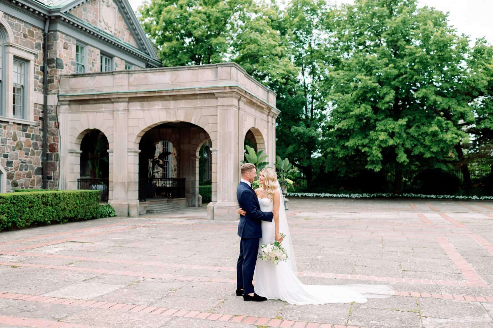 Bride and Groom editorial portrait in front of Graydon Hall Manor Estate Toronto Elopement | Jacqueline James Photography