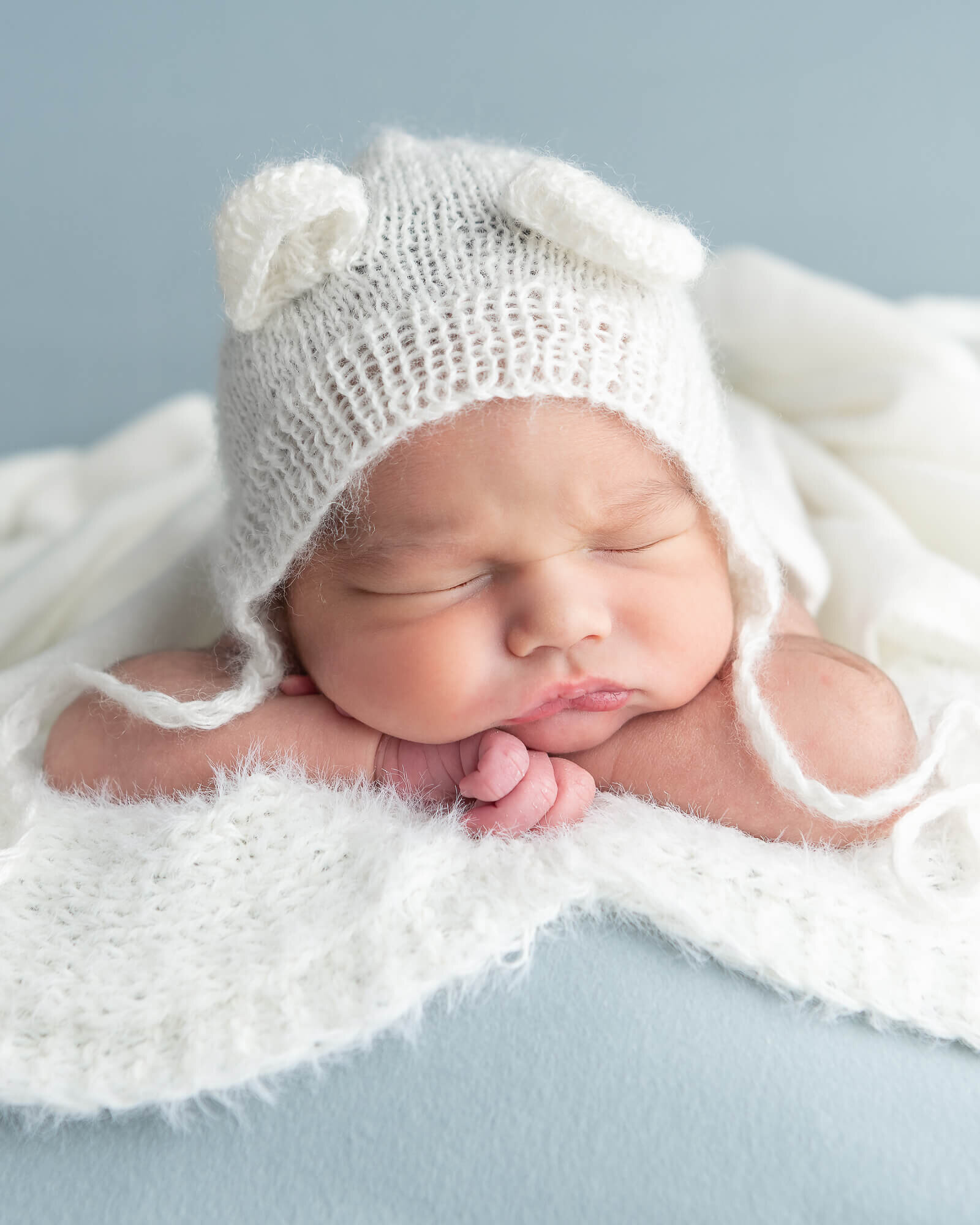 picture of newborn with bear bonnet