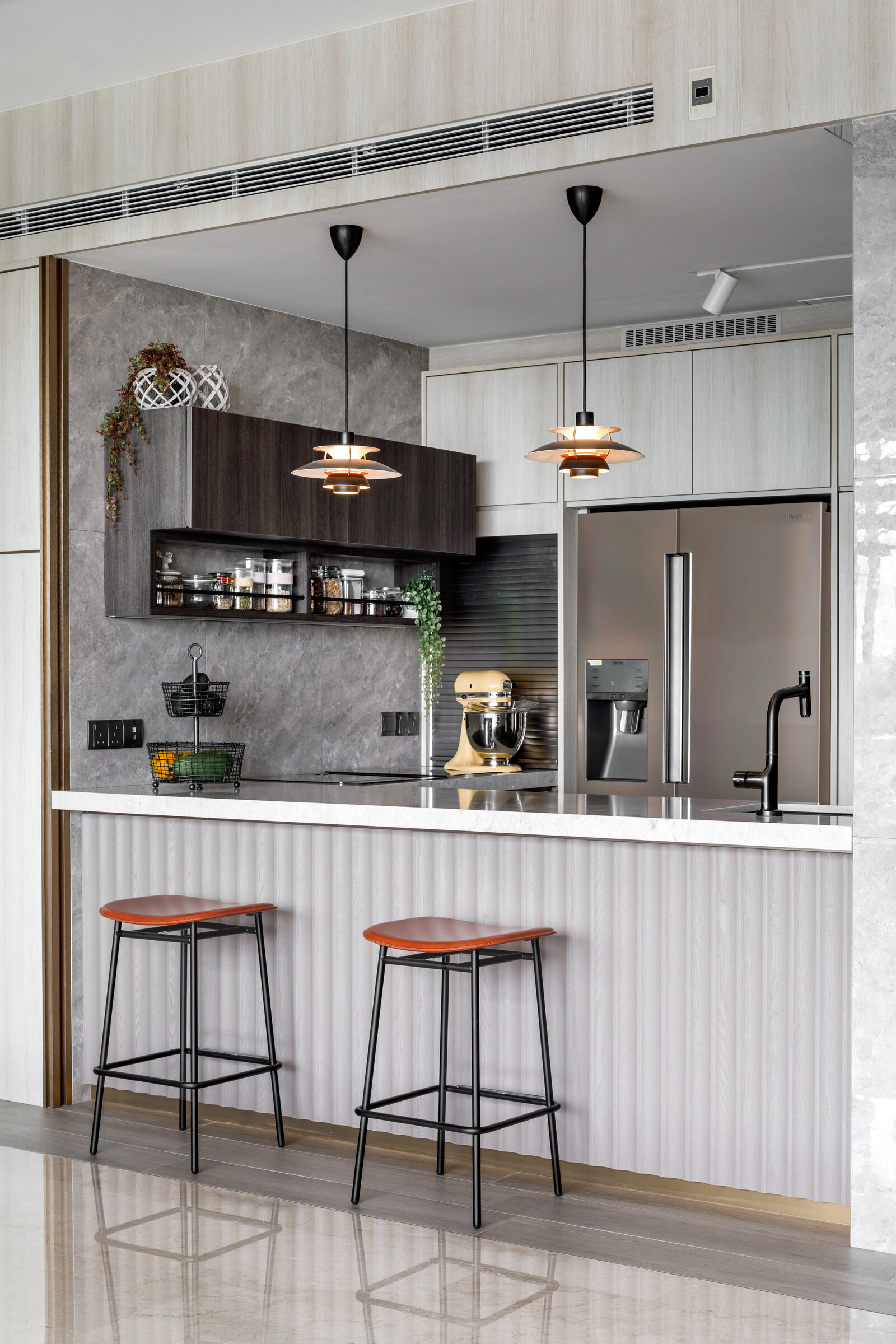 kitchen island with stools and lights