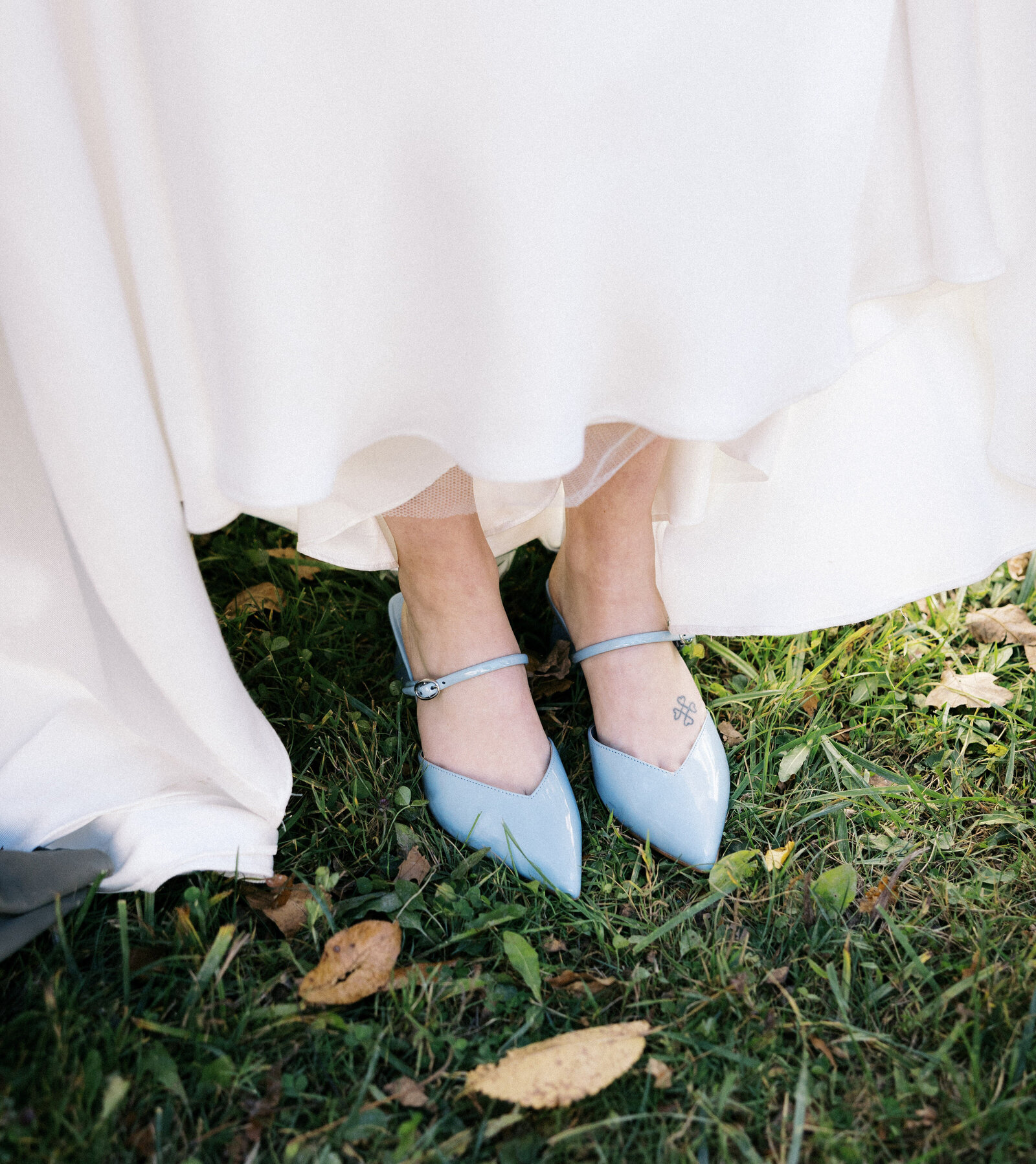 bride with her blue shoes at her wedding in vermont