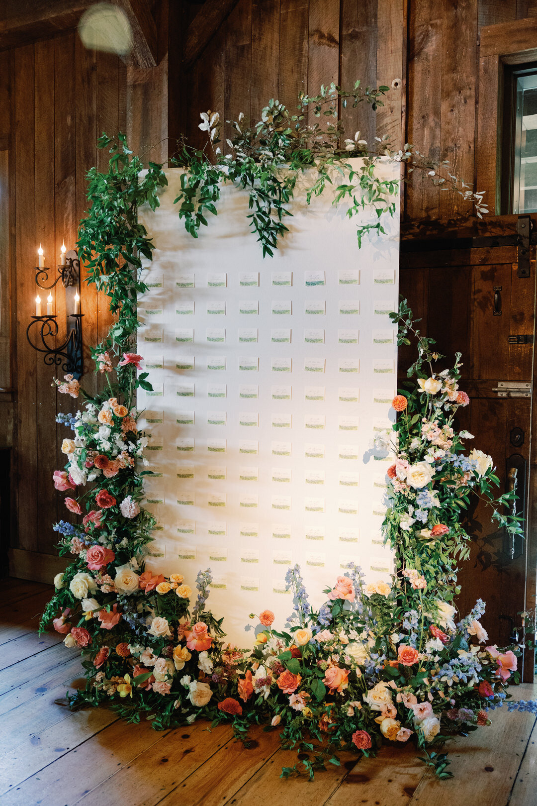 Wedding Reception Seating Chart with flowers at The Barn at Old Edwards Inn