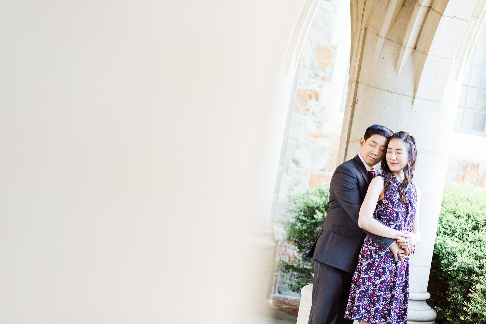 Couple embracing each other at a church arc