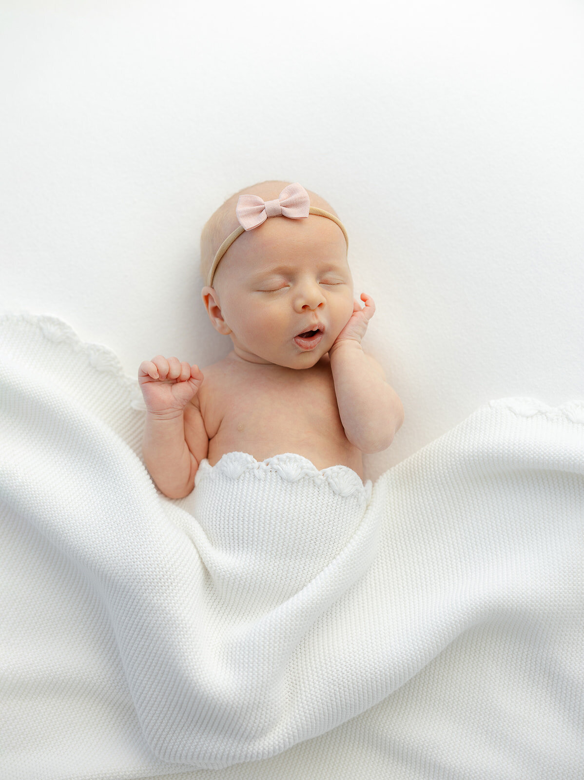 baby girl wearing pink bow