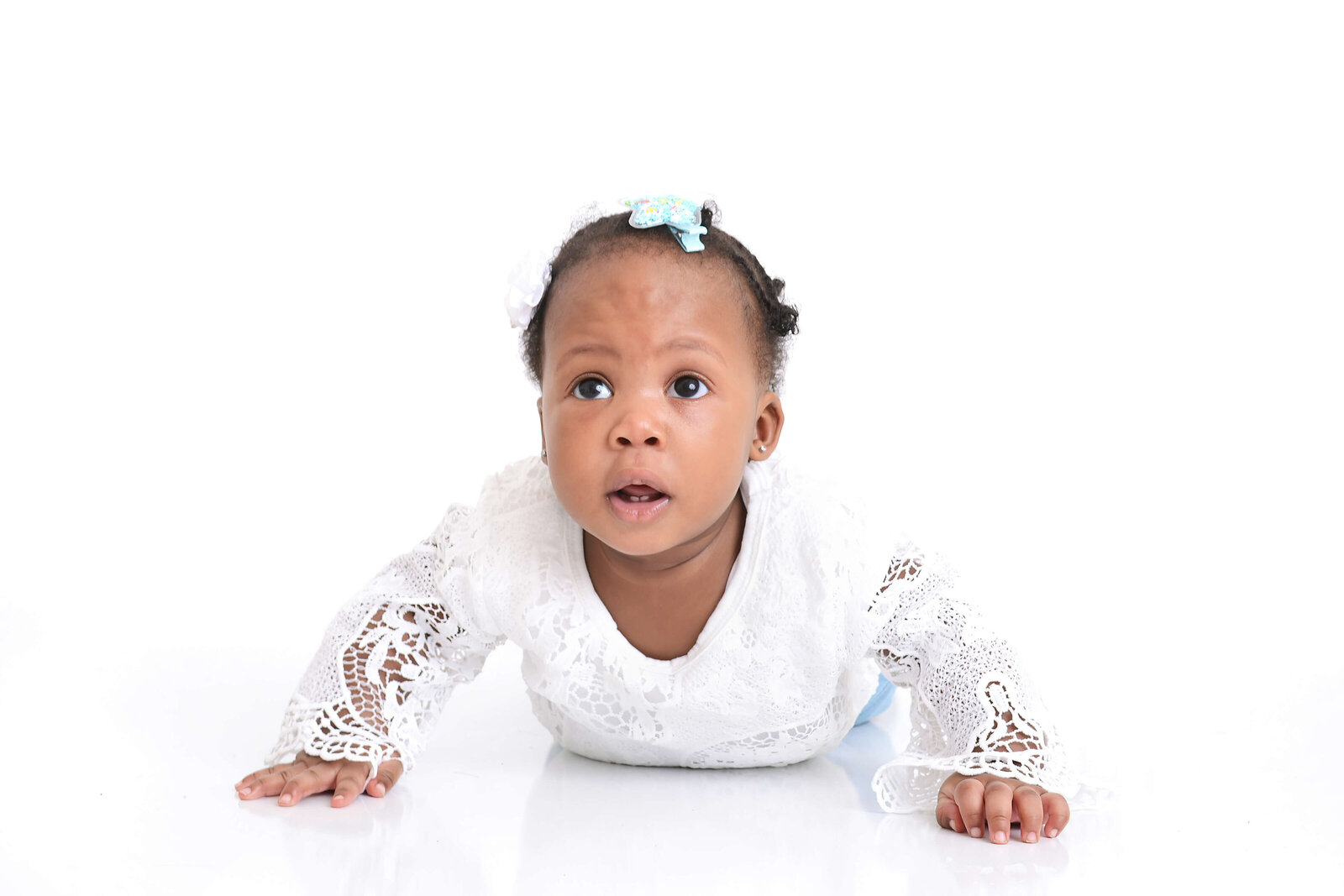 girl smiles on a simple white background