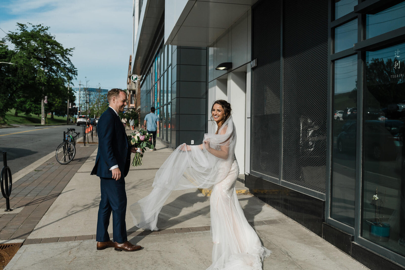 Candid moment of wedding couple downtown Halifax.