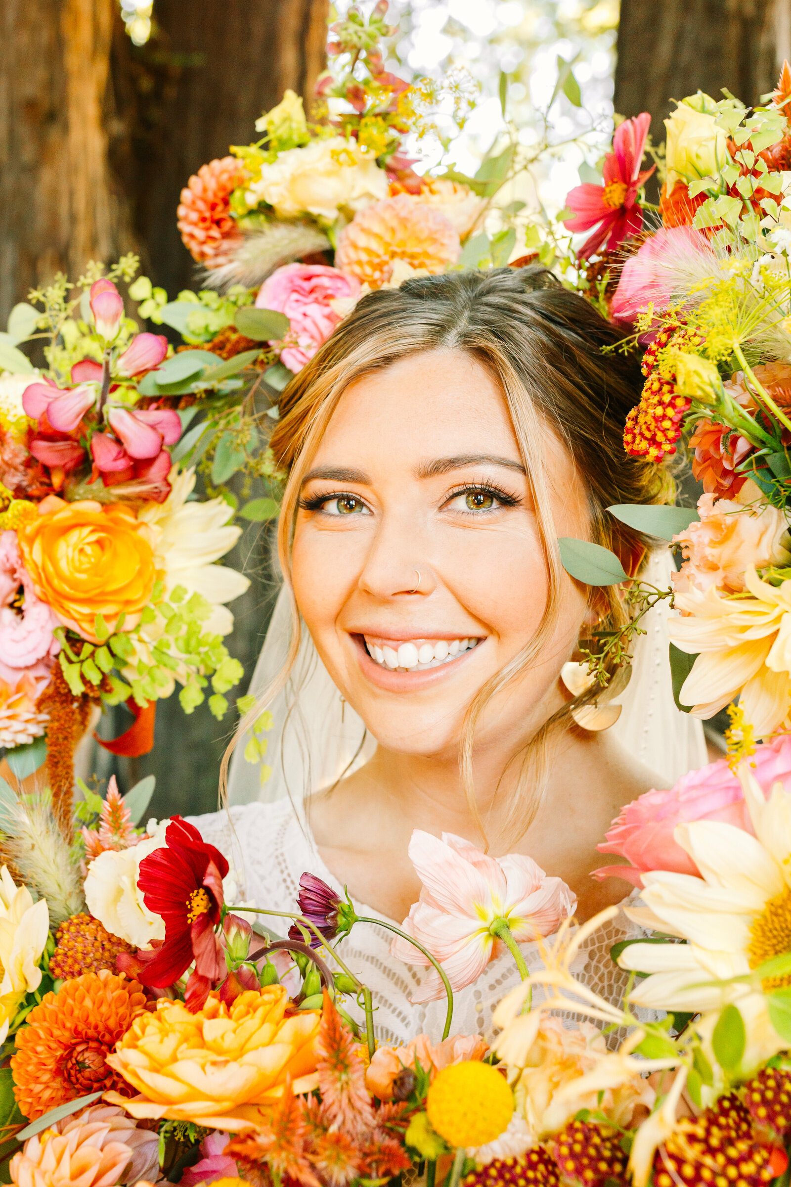Bride on her colorful wedding day in Santa Cruz, California in the redwood trees.