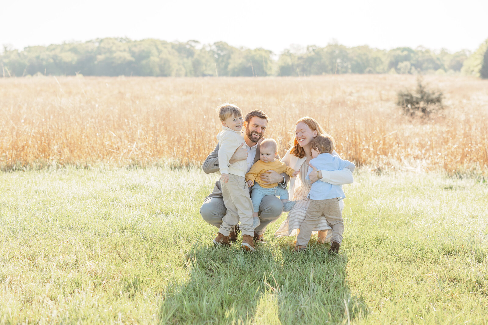 boys hug parents during family picture in Warrenton,VA