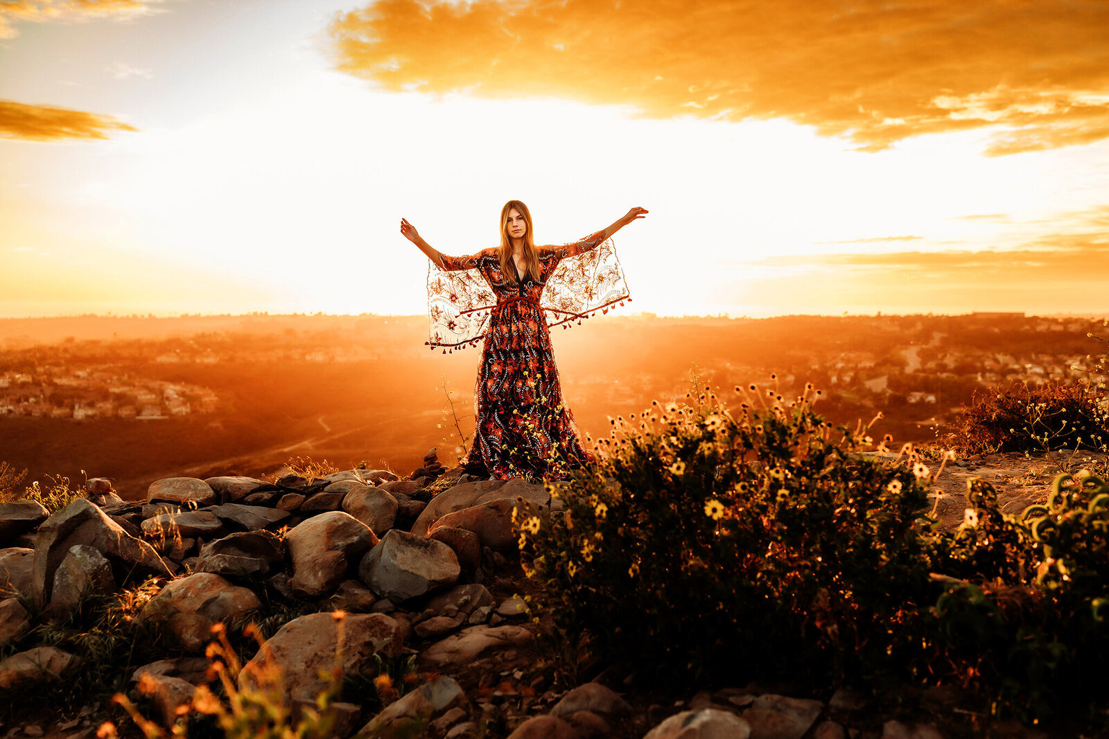 High school senior girl in a handmade gown on top of the Fort Collins mountains.