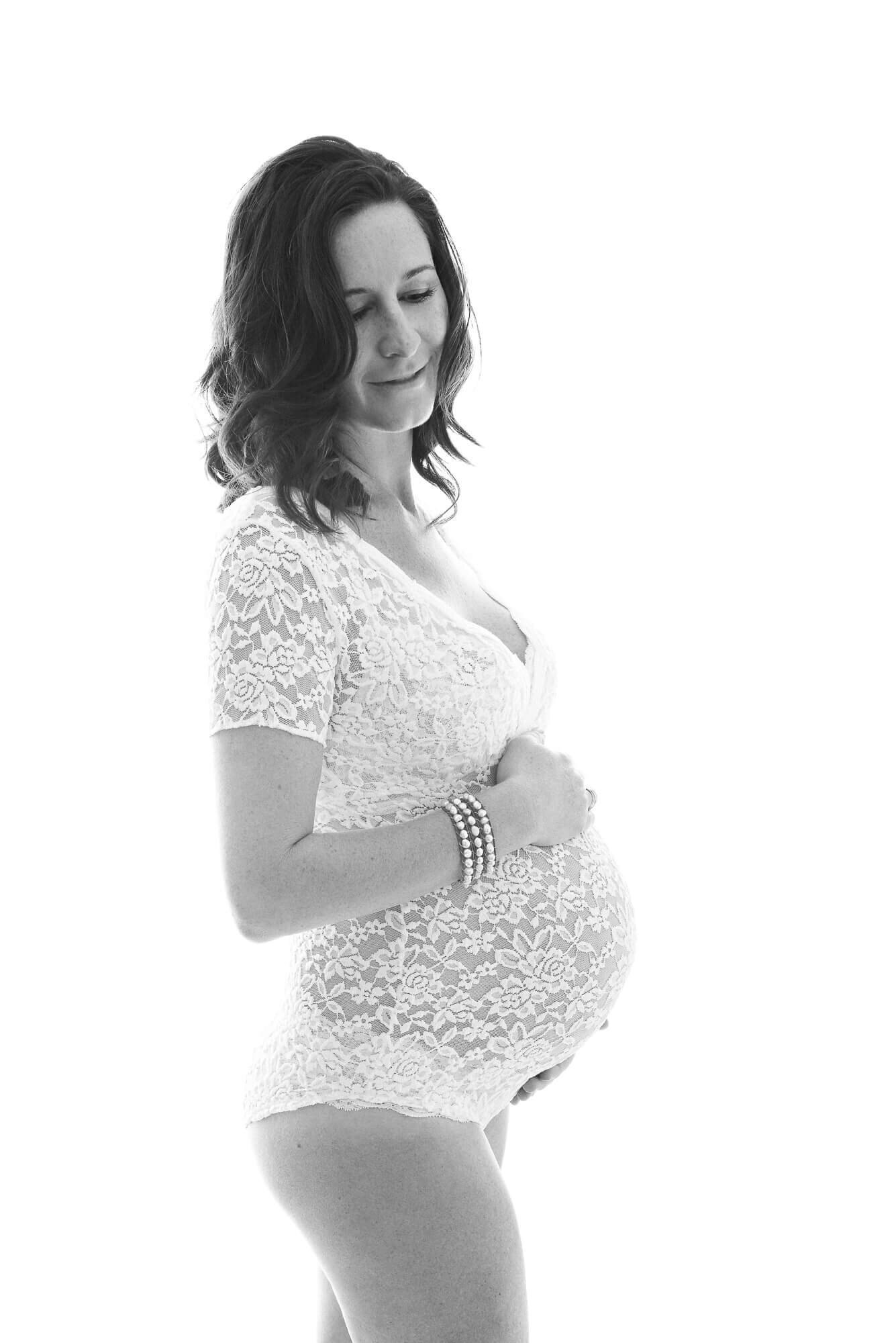beautiful modern maternity pictures, woman in lace bodysuit