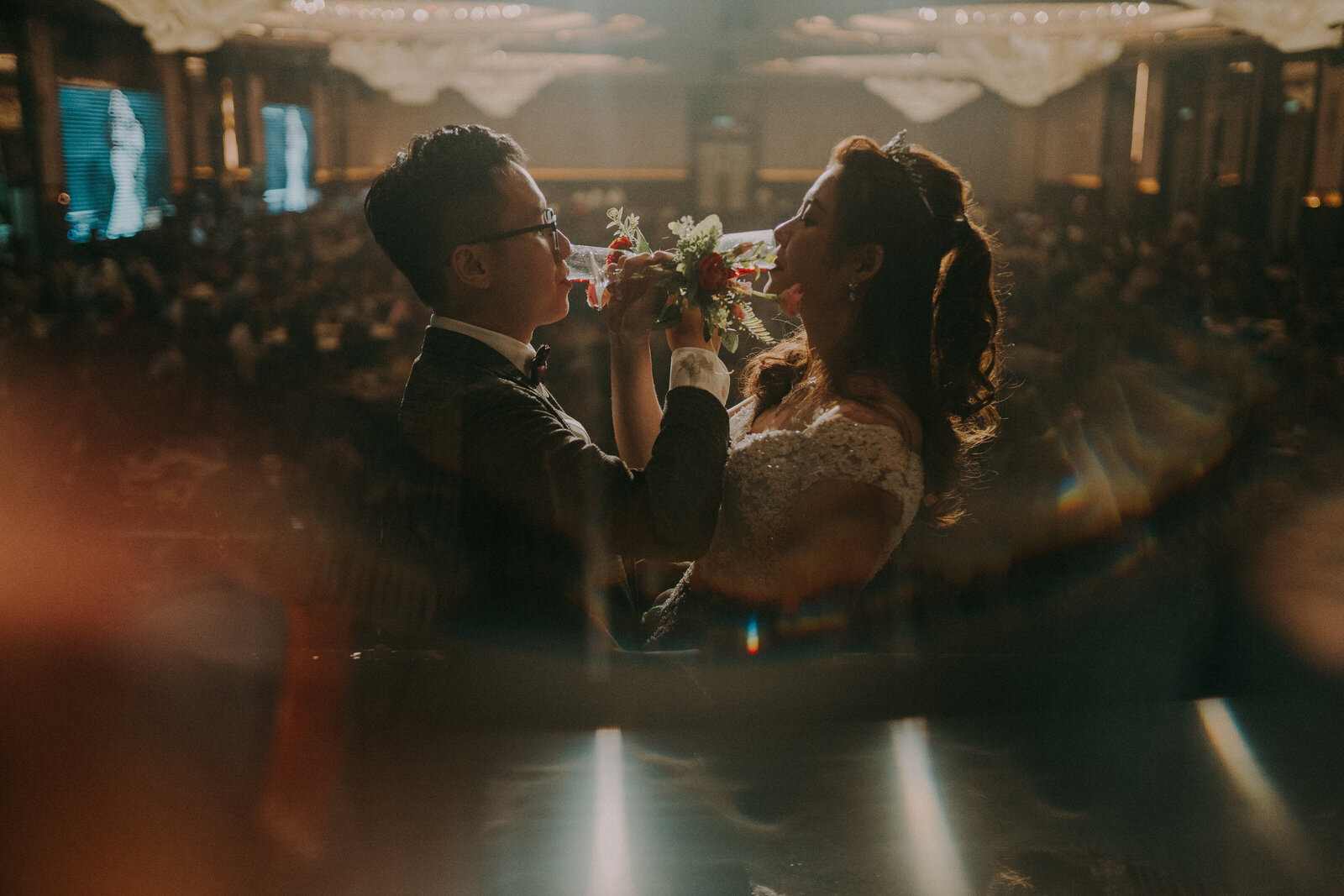 couple toasting in their wedding dinner