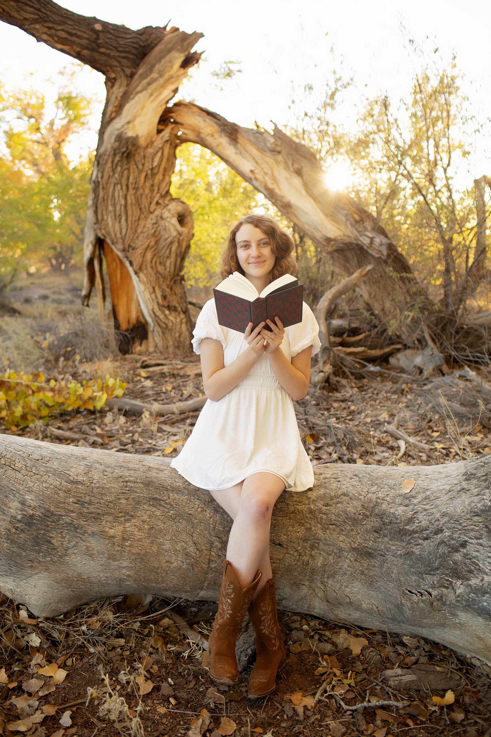 sunset-senior-session-whimsical-girl-reading-a-book