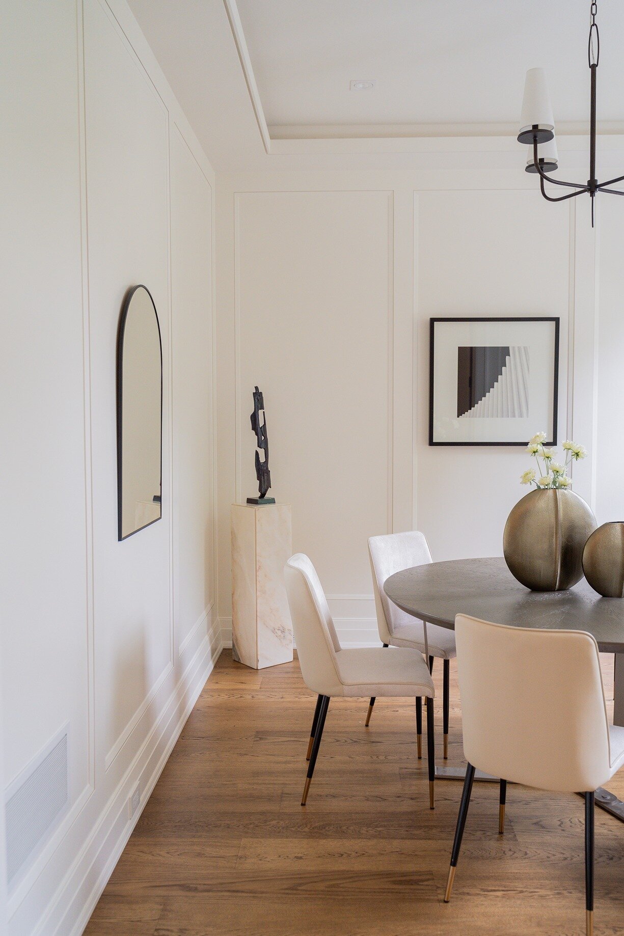 Dining room setup with modern art on walls