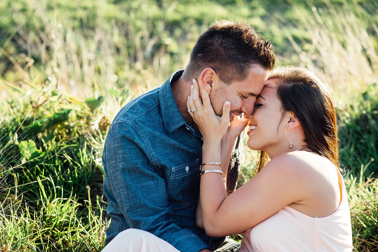 couples kissing in the grass