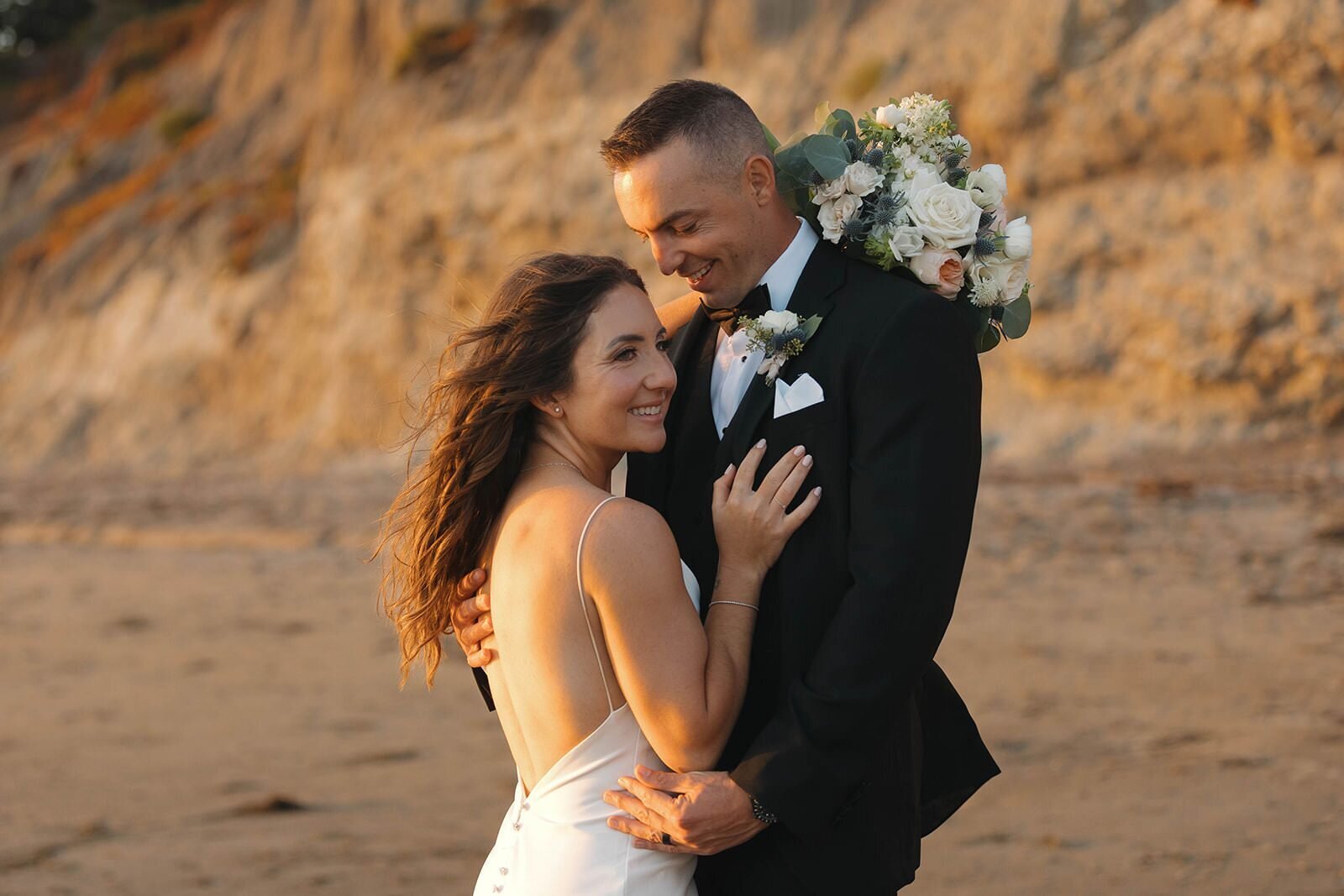 Alex and Gregory at sunset on the Pismo Beach cliffs