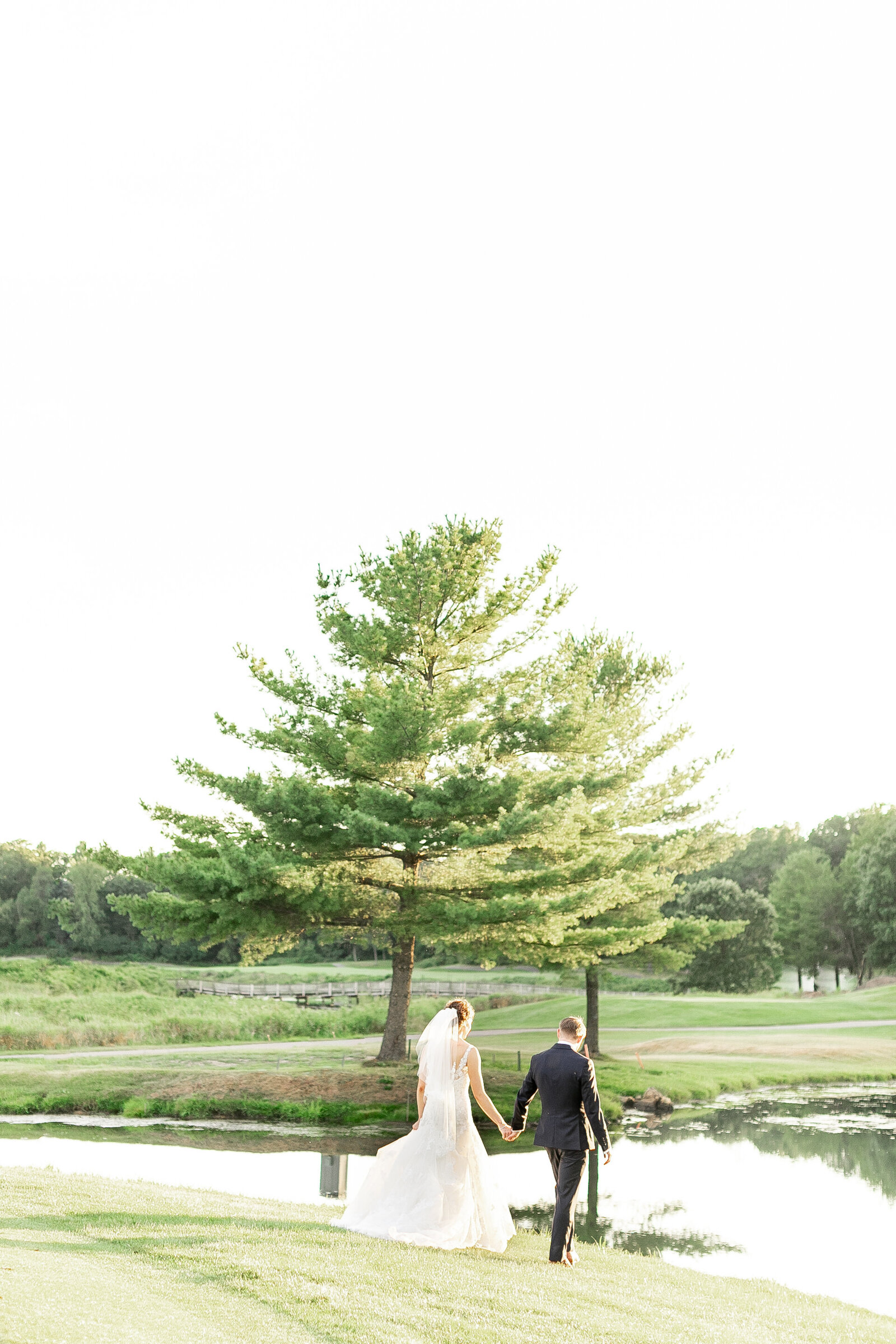 31-trappers_turn_golf_course_bride_and_groom_holding_hands_and_walking