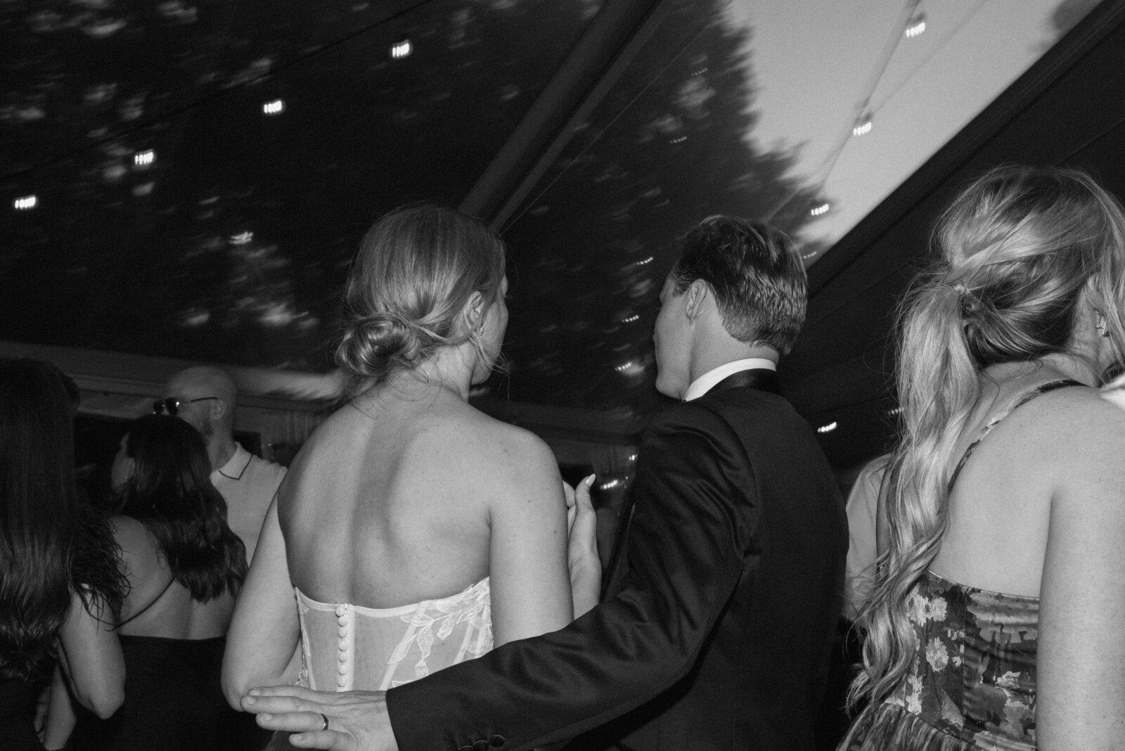 black and white photo of bride and groom during their wedding reception
