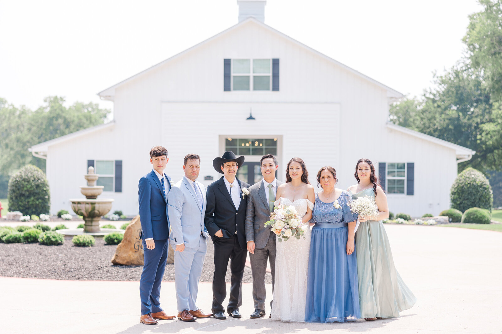 Couple photography with family members after ceremony