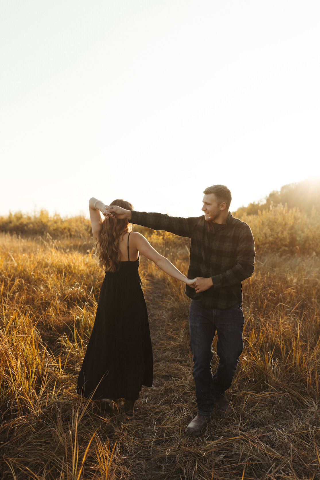 Man and woman dancing in a field together