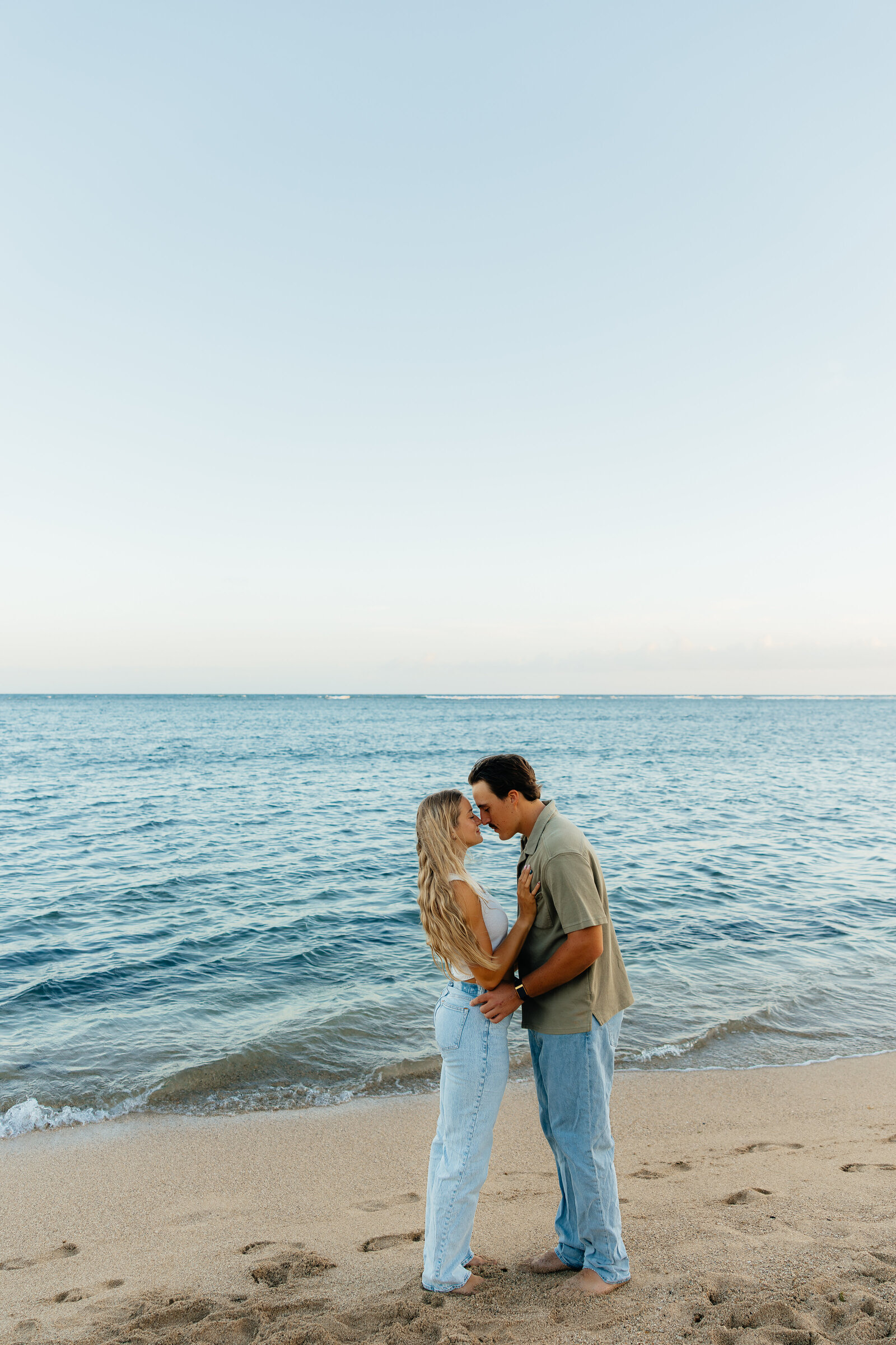 Romantic beach couples session with ocean views in Hawaii