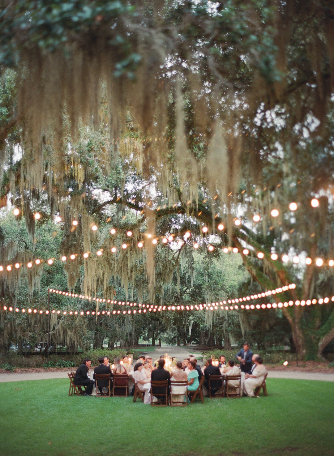 Wedding reception under lights on front lawn at Brays Island in SC