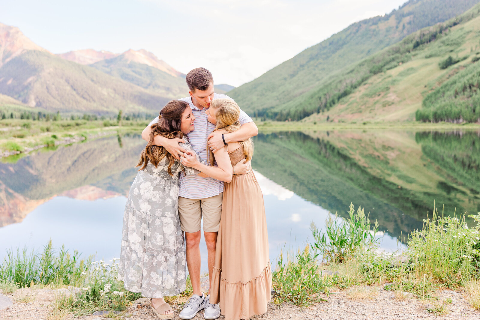 grown up kids hug for photo in ouray