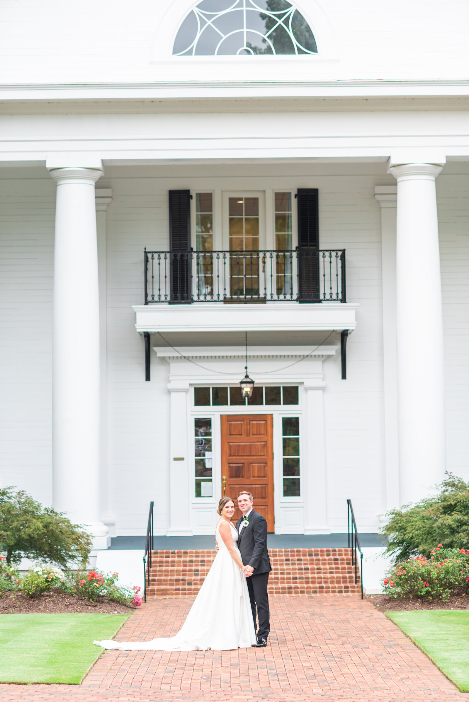 bride and groom in front of their wedding Of course! Have you two started looking at venues yet? I’d love to send over our preferred vendor guide if it’s helpful 😊