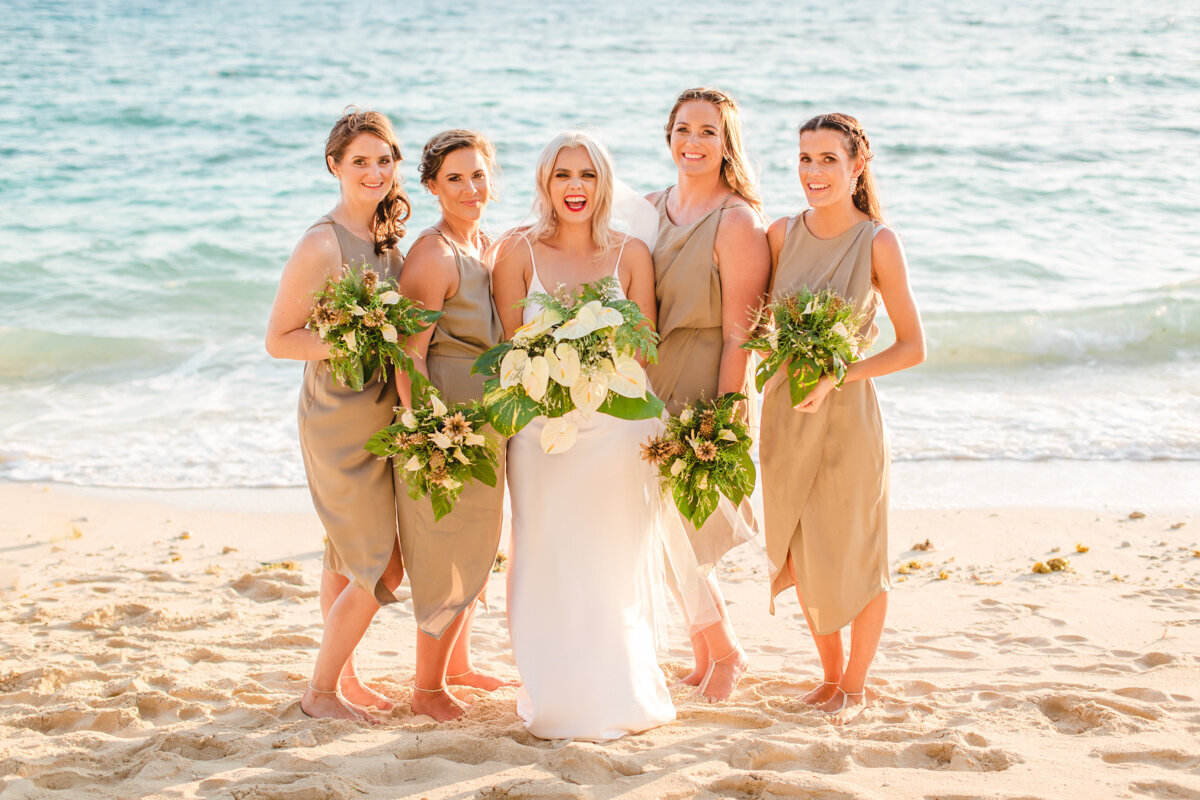 Bride and her bridesmaids on the beach