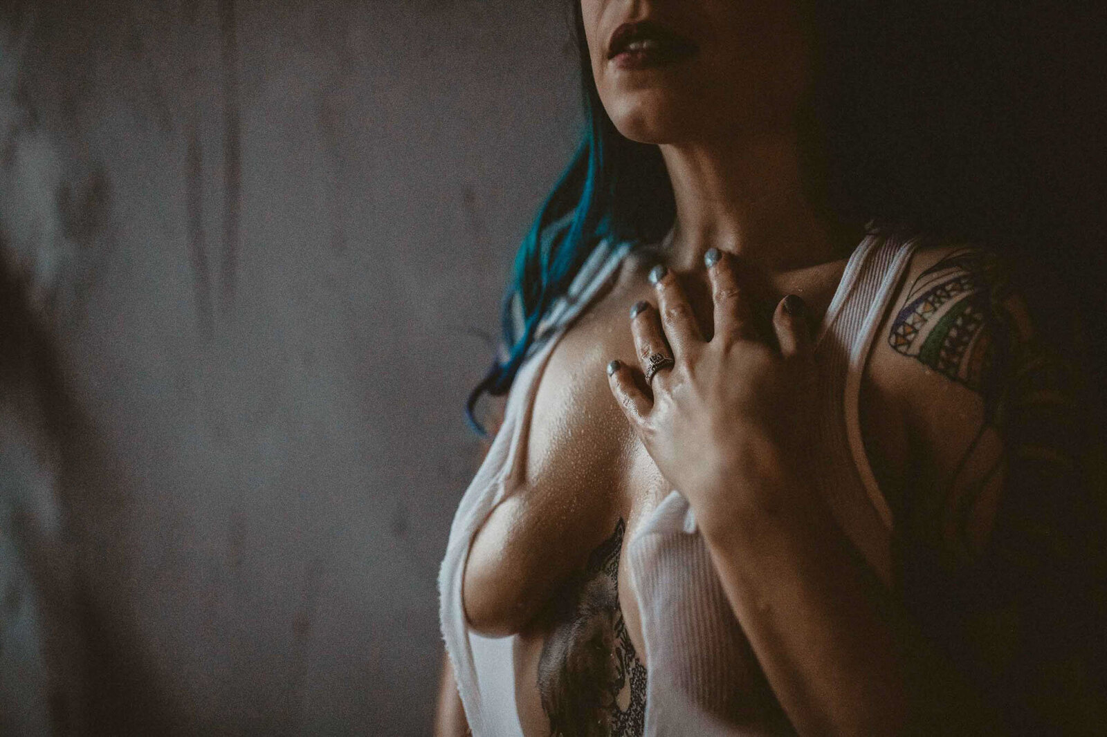 photo of a woman holding her chest
