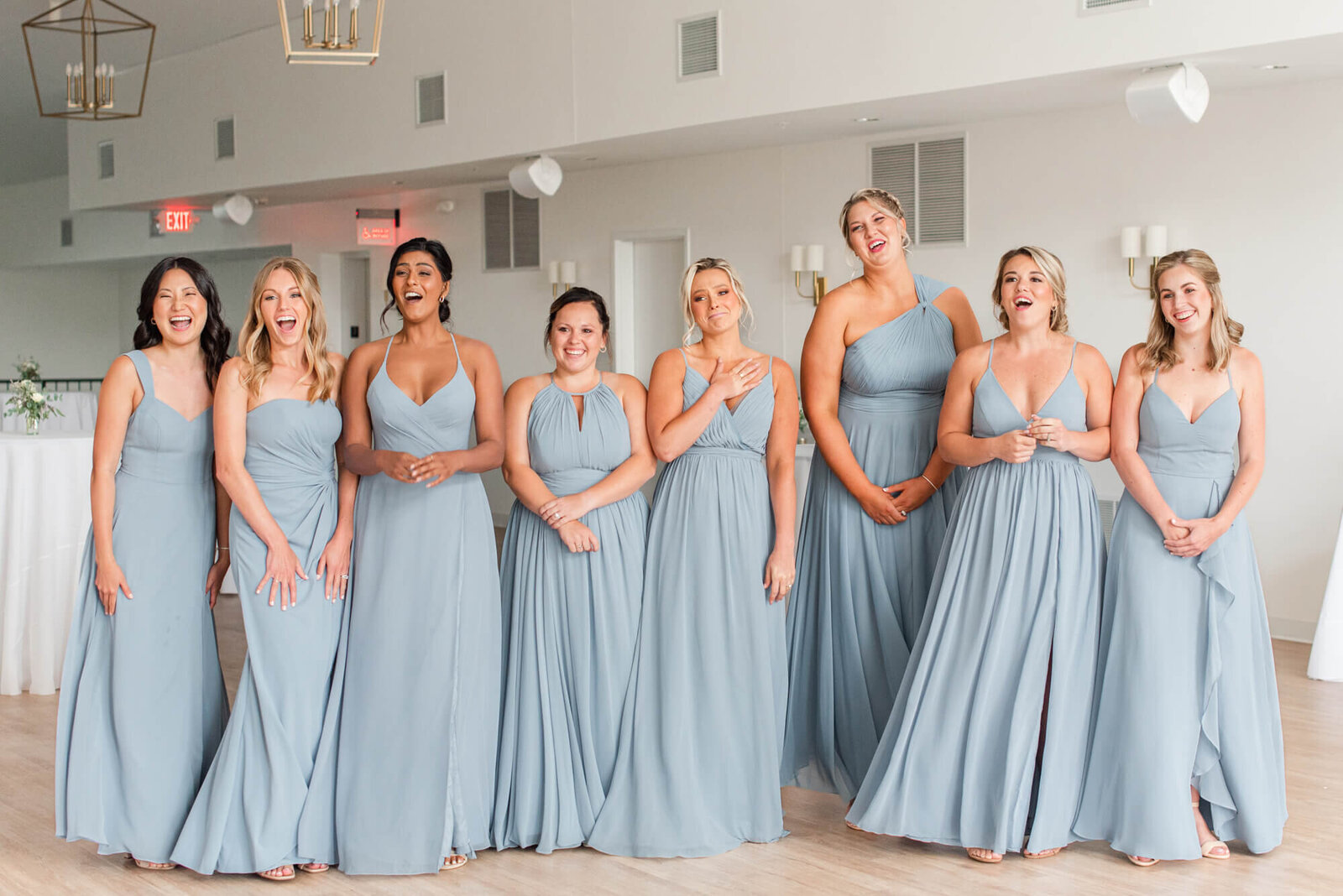Bridesmaids looking happy, seeing the bride for the first time, at The Eloise wedding venue near Madison, WI