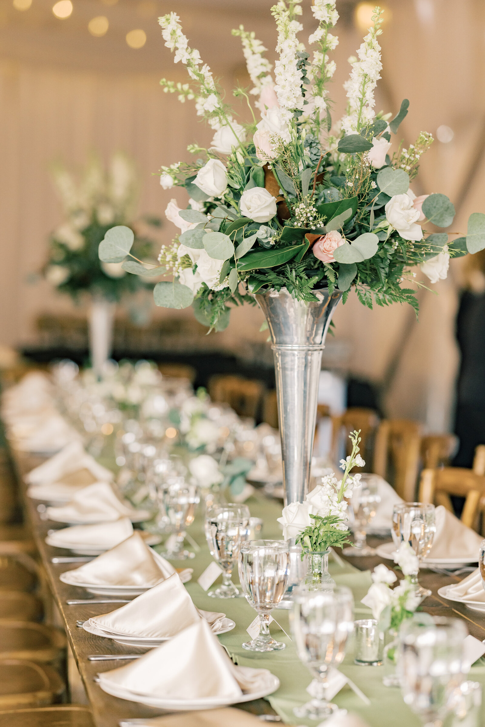 Luxurious wedding reception decorations at Inola in Blue Ridge, GA, featuring refined floral arrangements, romantic lighting, and sophisticated table settings